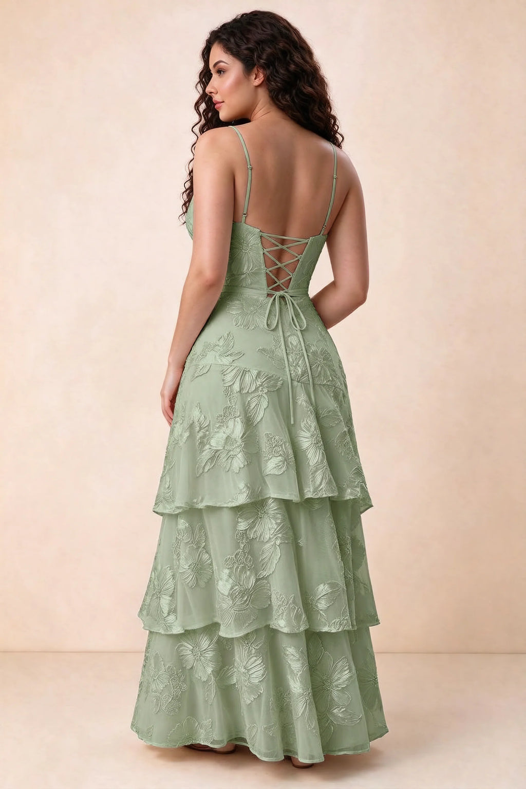 Rear studio view of Bonnie sage green dress showing three overlapping tiers and an ankle-length hem