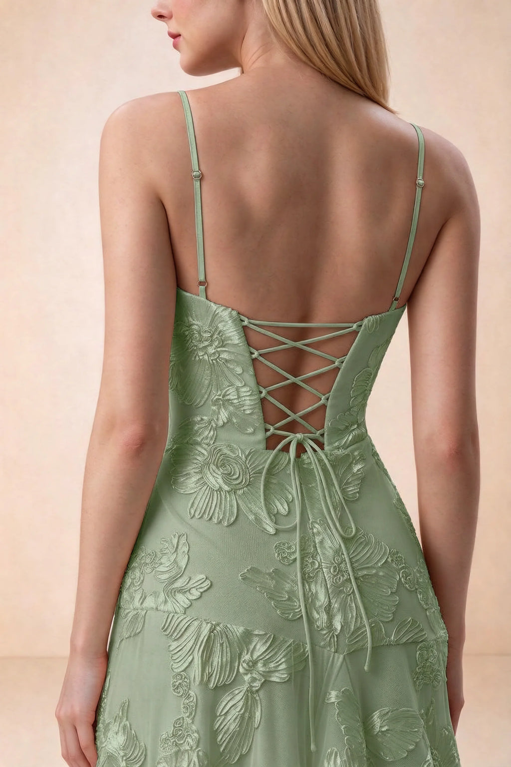 Close-up of Bonnie sage green adjustable strap sliders and crossed back lacing