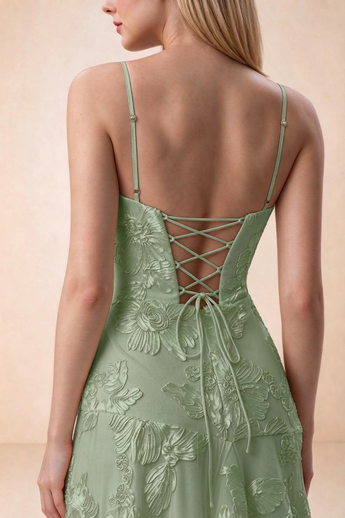 Close-up of Bonnie sage green adjustable strap sliders and crossed back lacing