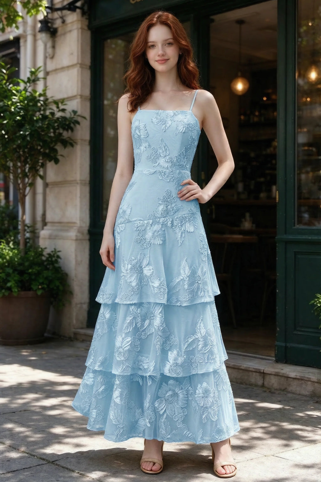 Outdoor front view of Bonnie sky blue floral ruffle dress outside a cafe