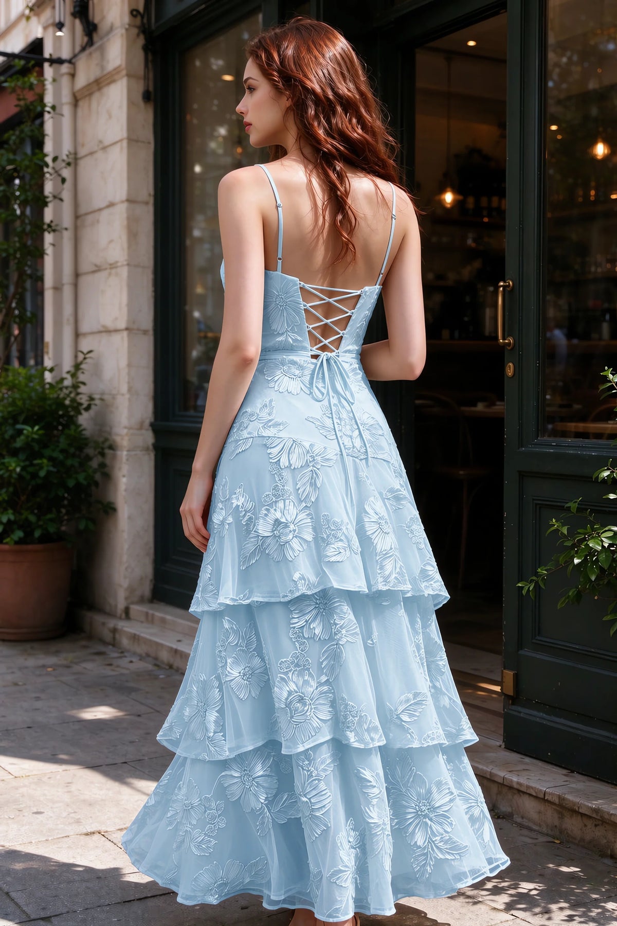 Outdoor rear view of Bonnie sky blue dress showing the lace-up back and layered skirt