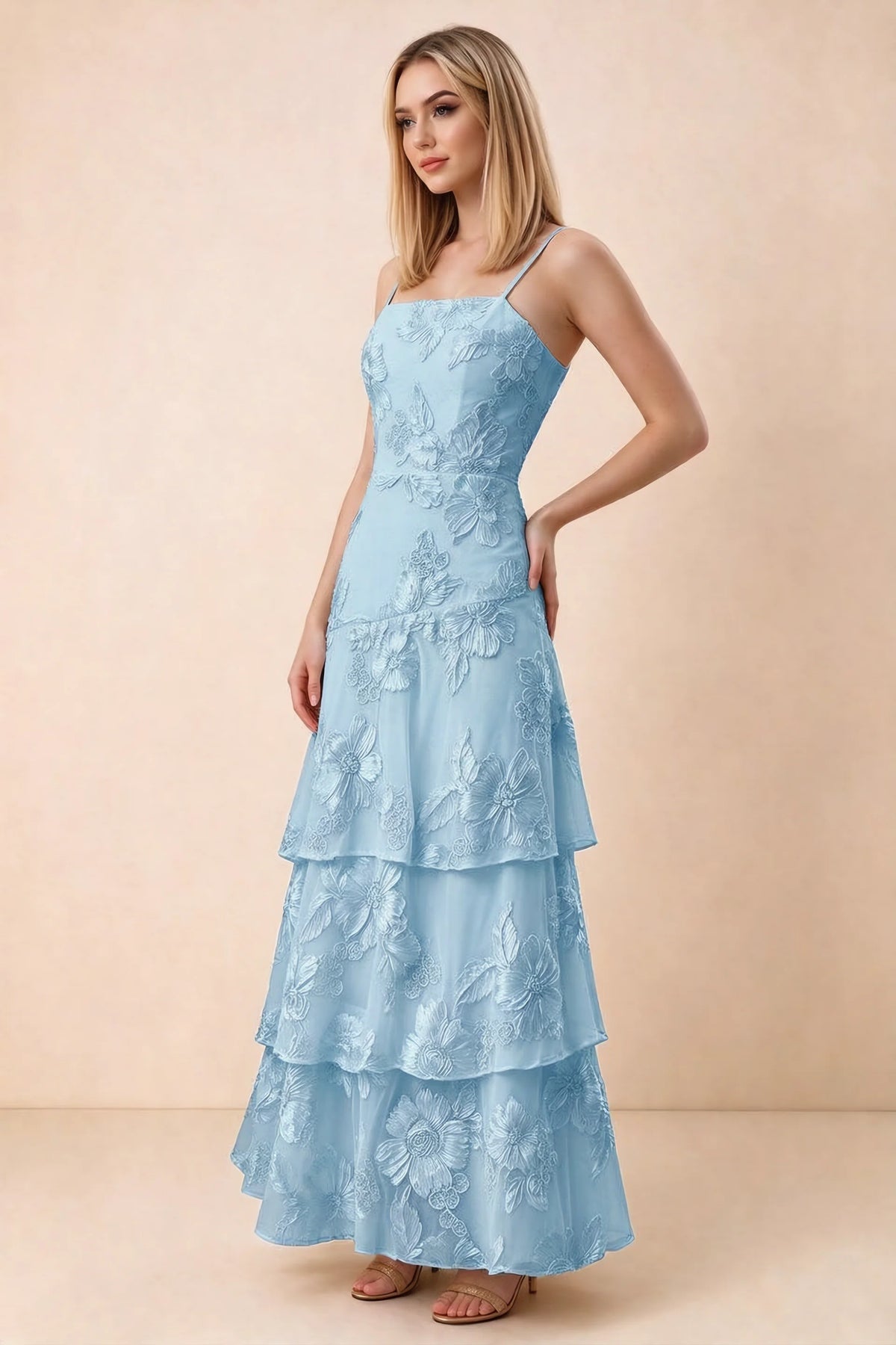 Three-quarter studio view of Bonnie sky blue dress showing the fitted waist and flared ruffle tiers