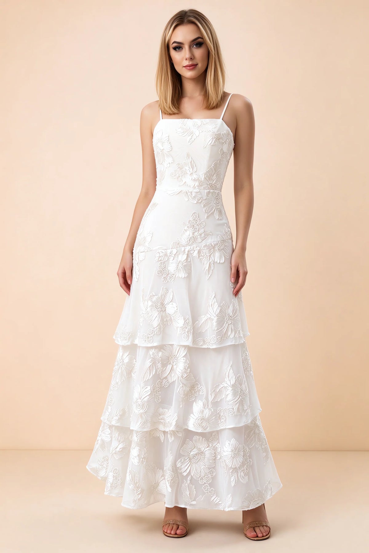 Front studio view of Bonnie white floral lace maxi dress with thin straps and three ruffle tiers