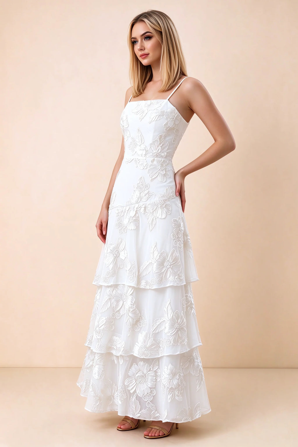 Three-quarter studio view of Bonnie white dress showing the fitted waist and flared ruffle tiers