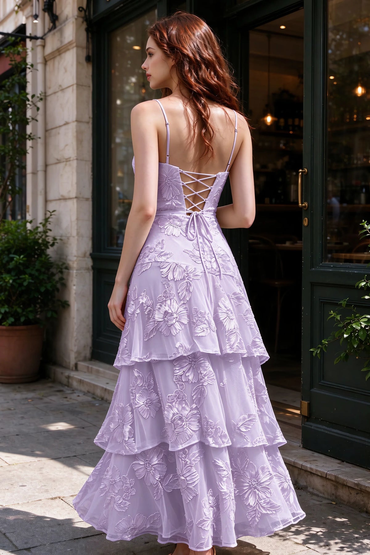 Outdoor rear view of Bonnie wisteria dress showing the lace-up back and layered skirt