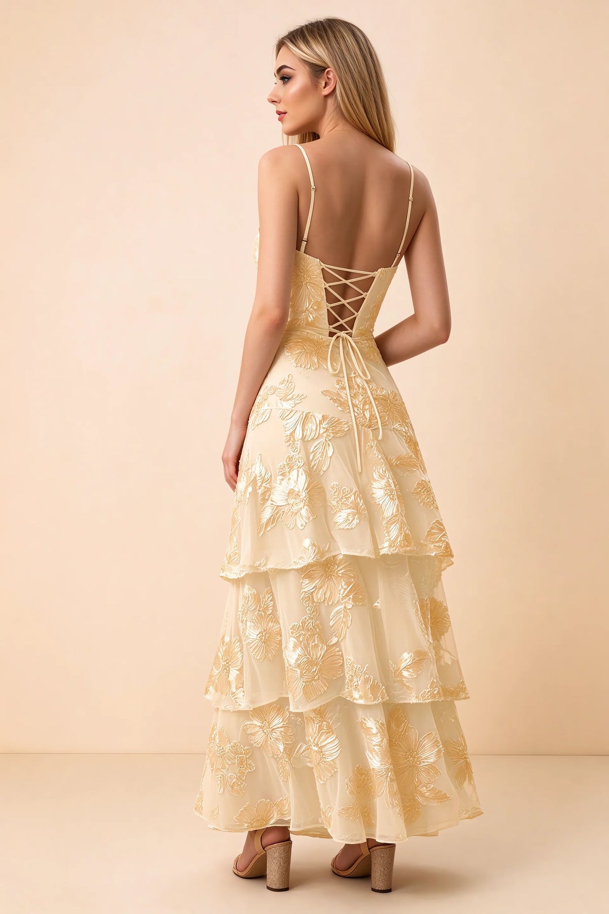 Rear studio view of Bonnie yellow dress showing adjustable straps, back lacing and tiered ruffles