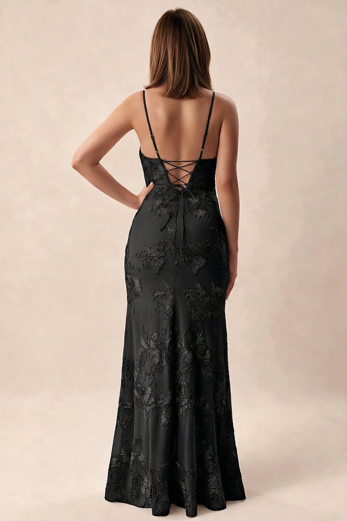 Rear studio view of Brianna black dress showing adjustable shoulder straps and crossed back lacing
