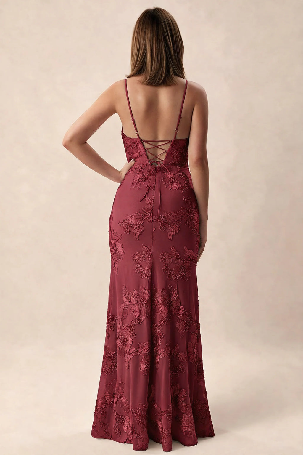 Rear studio view of Brianna burgundy dress showing adjustable shoulder straps and crossed back lacing
