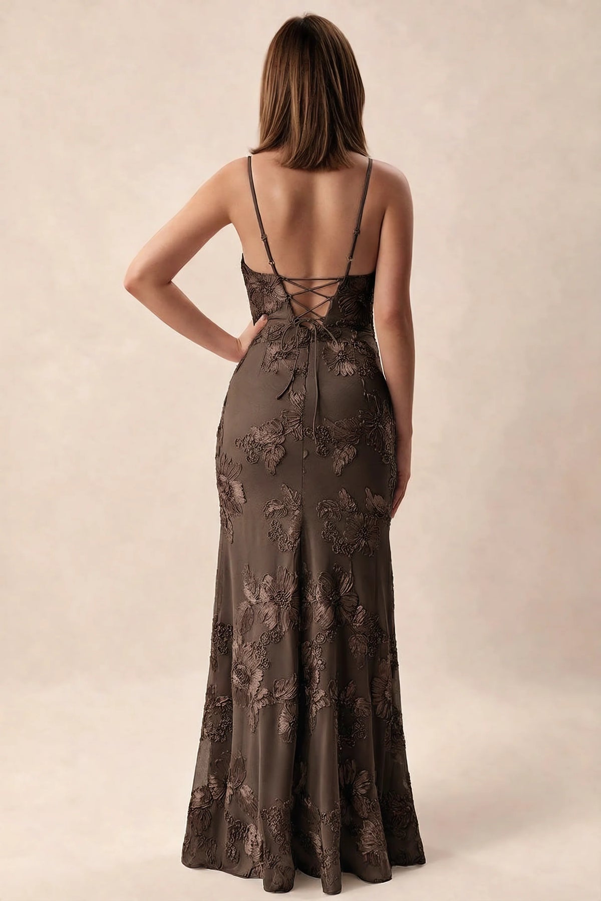 Rear studio view of Brianna chocolate brown dress showing adjustable shoulder straps and crossed back lacing
