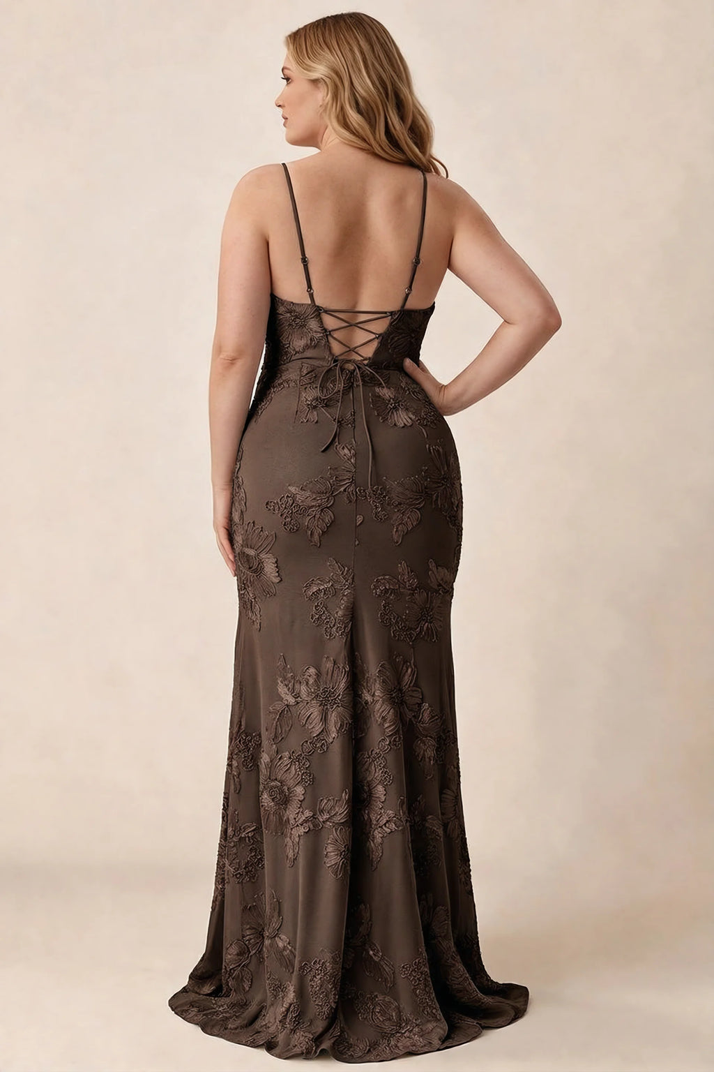 Rear studio view of Brianna chocolate brown floral dress showing the fitted hips and long hem