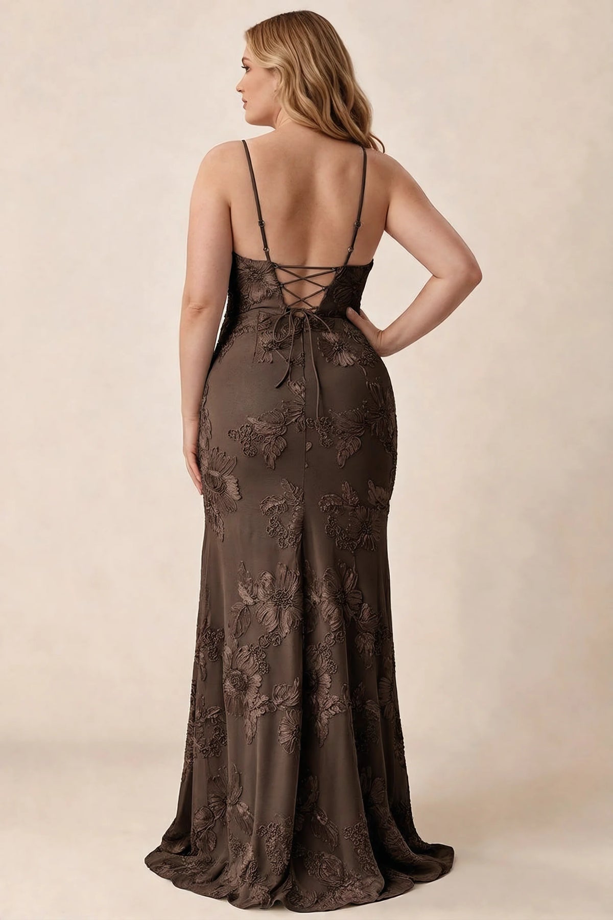 Rear studio view of Brianna chocolate brown floral dress showing the fitted hips and long hem