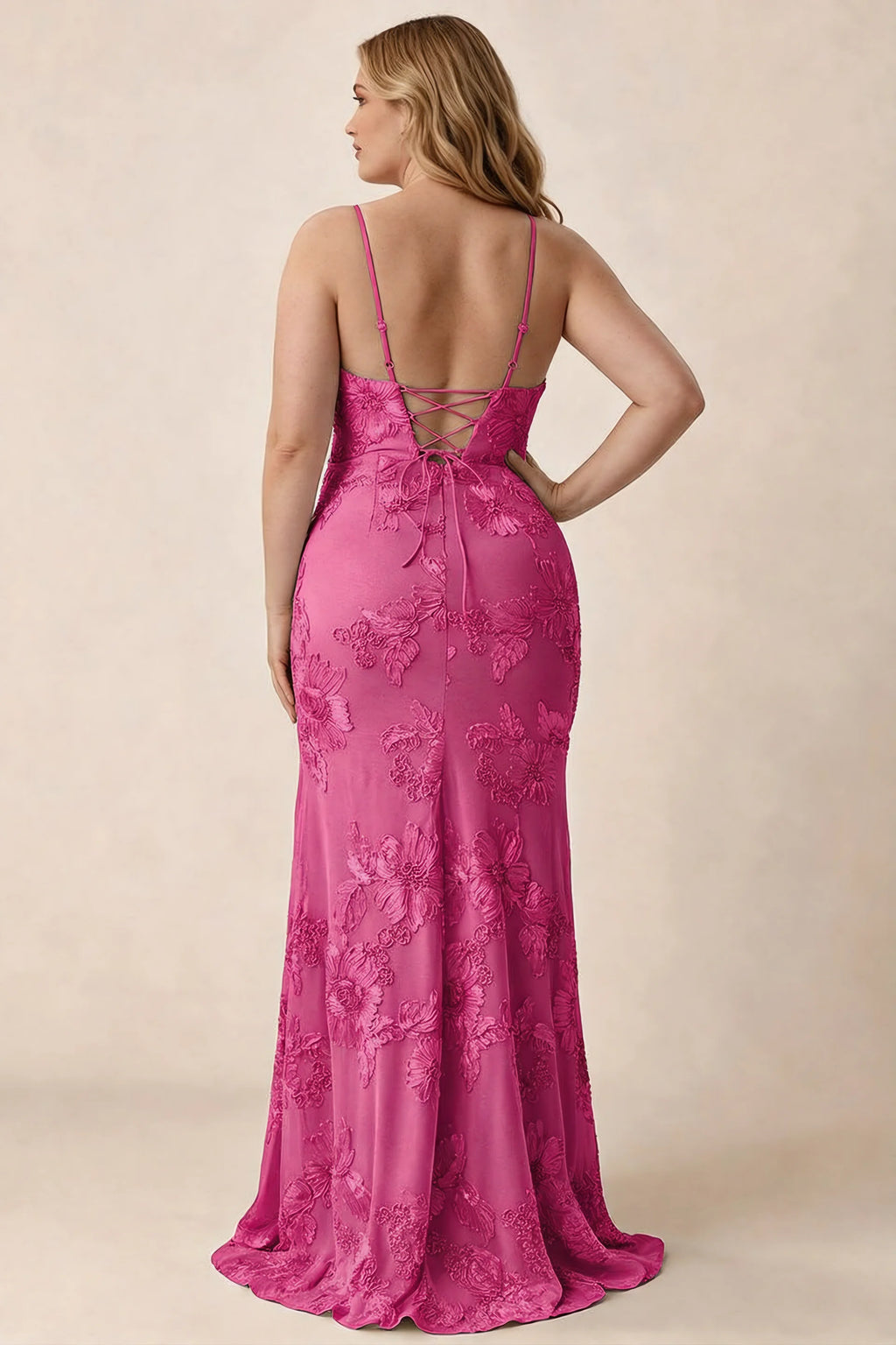 Rear studio view of Brianna fuchsia floral dress showing the fitted hips and long hem