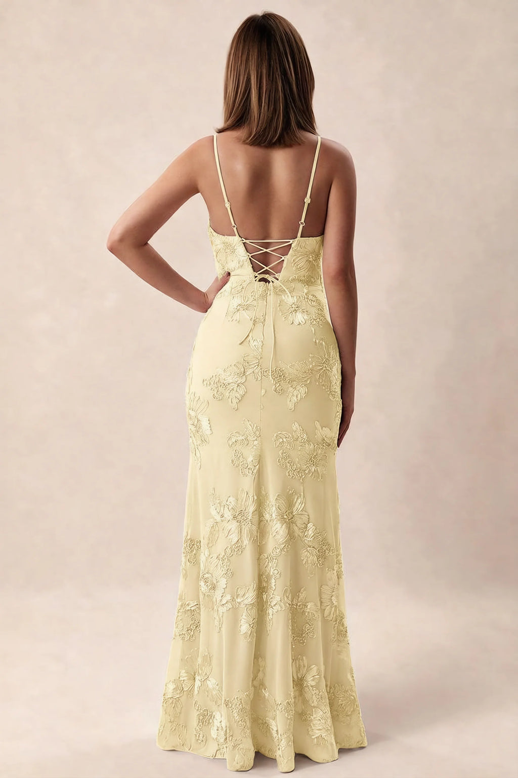 Rear studio view of Brianna lemon dress showing adjustable shoulder straps and crossed back lacing
