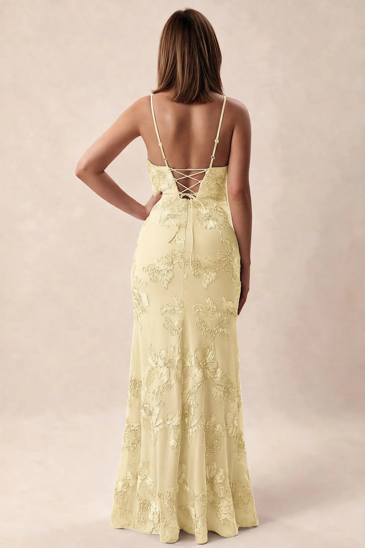 Rear studio view of Brianna lemon dress showing adjustable shoulder straps and crossed back lacing