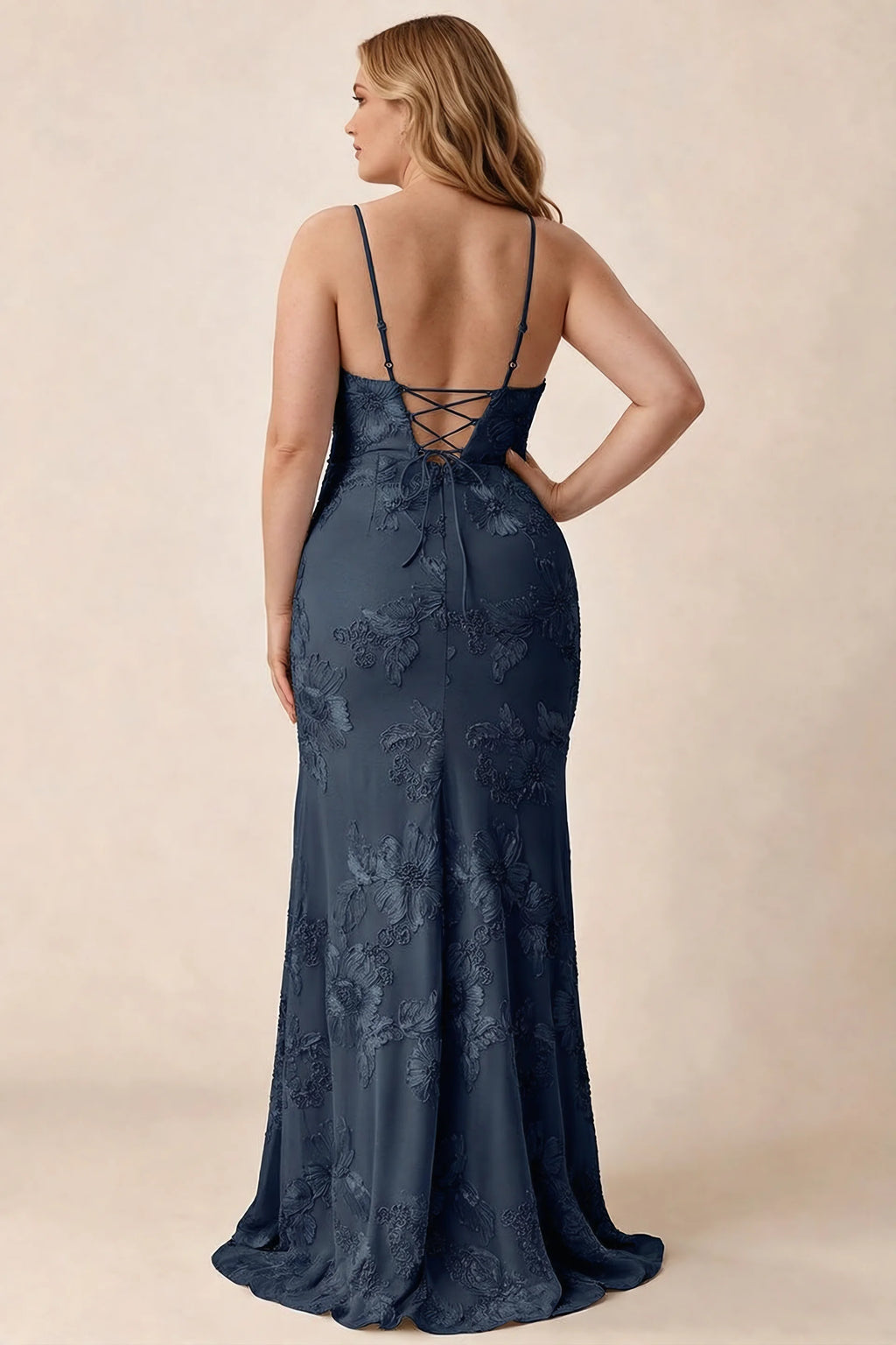 Rear studio view of Brianna navy floral dress showing the fitted hips and long hem