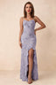 Front studio view of Brianna pale purple floral maxi dress with thin straps and a high ruffle-edged opening