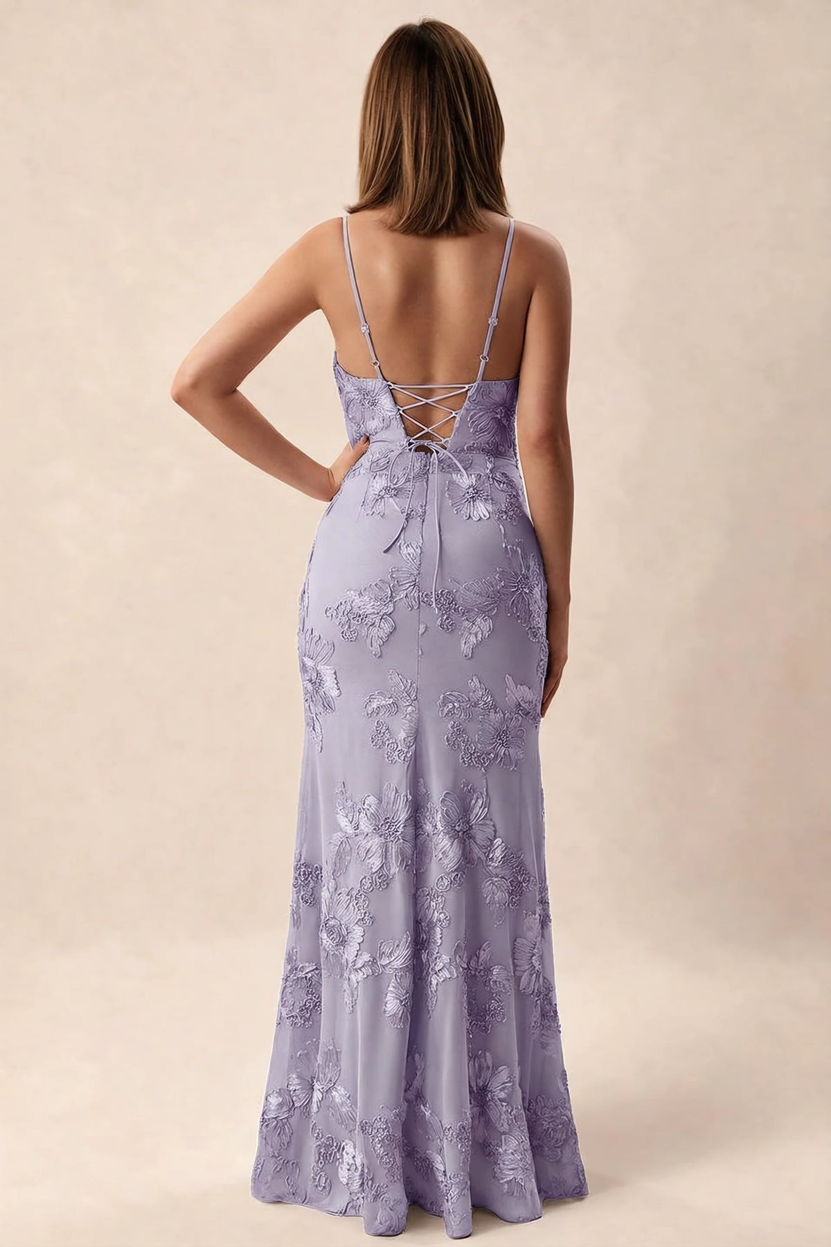 Rear studio view of Brianna pale purple dress showing adjustable shoulder straps and crossed back lacing
