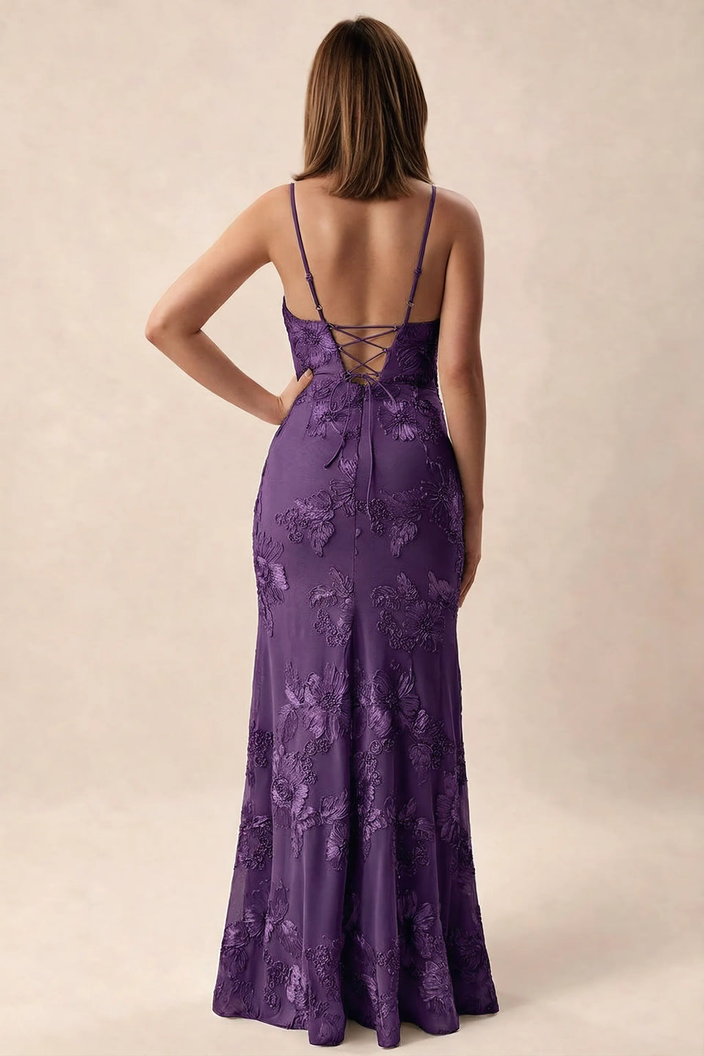 Rear studio view of Brianna plum dress showing adjustable shoulder straps and crossed back lacing