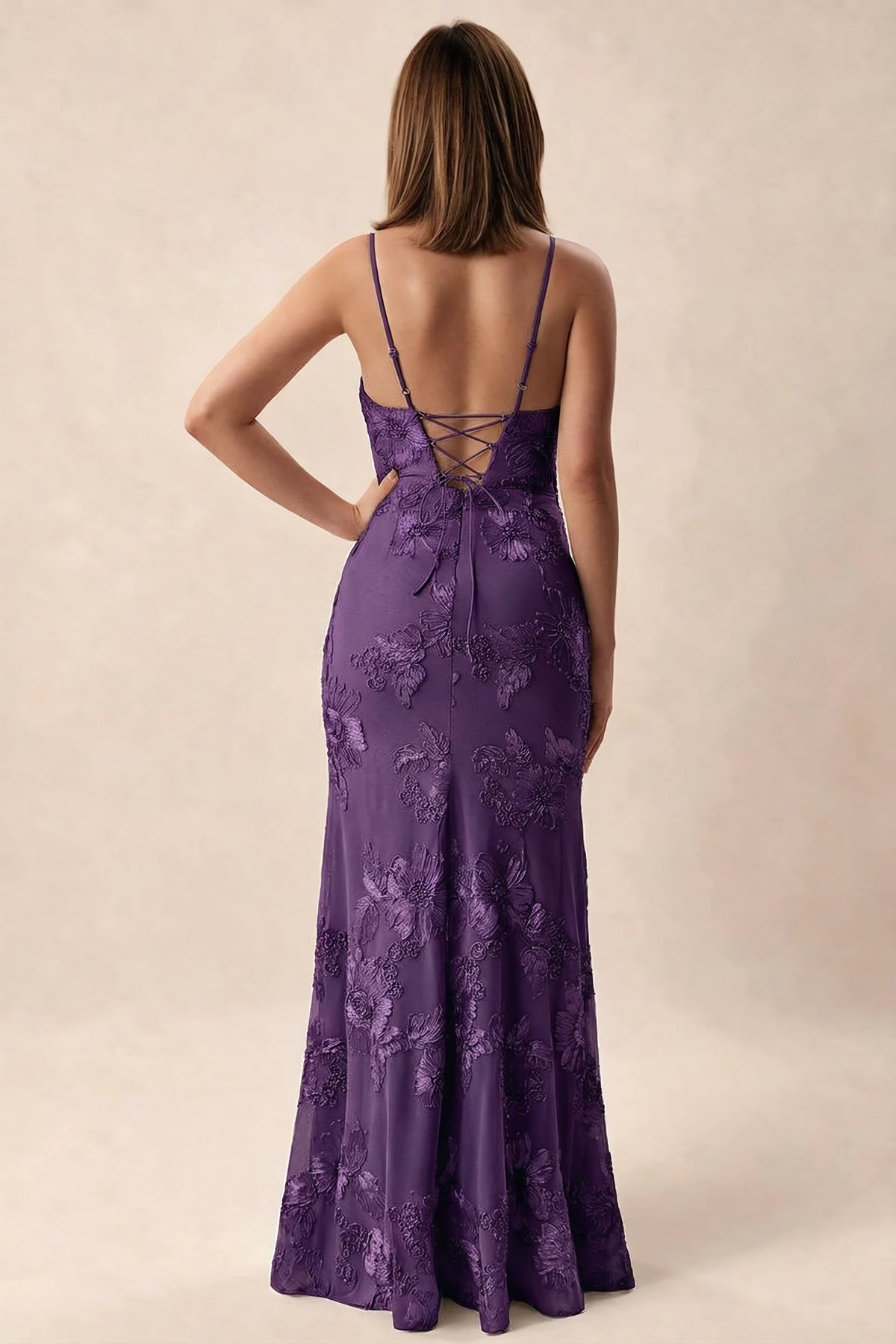 Rear studio view of Brianna plum dress showing adjustable shoulder straps and crossed back lacing