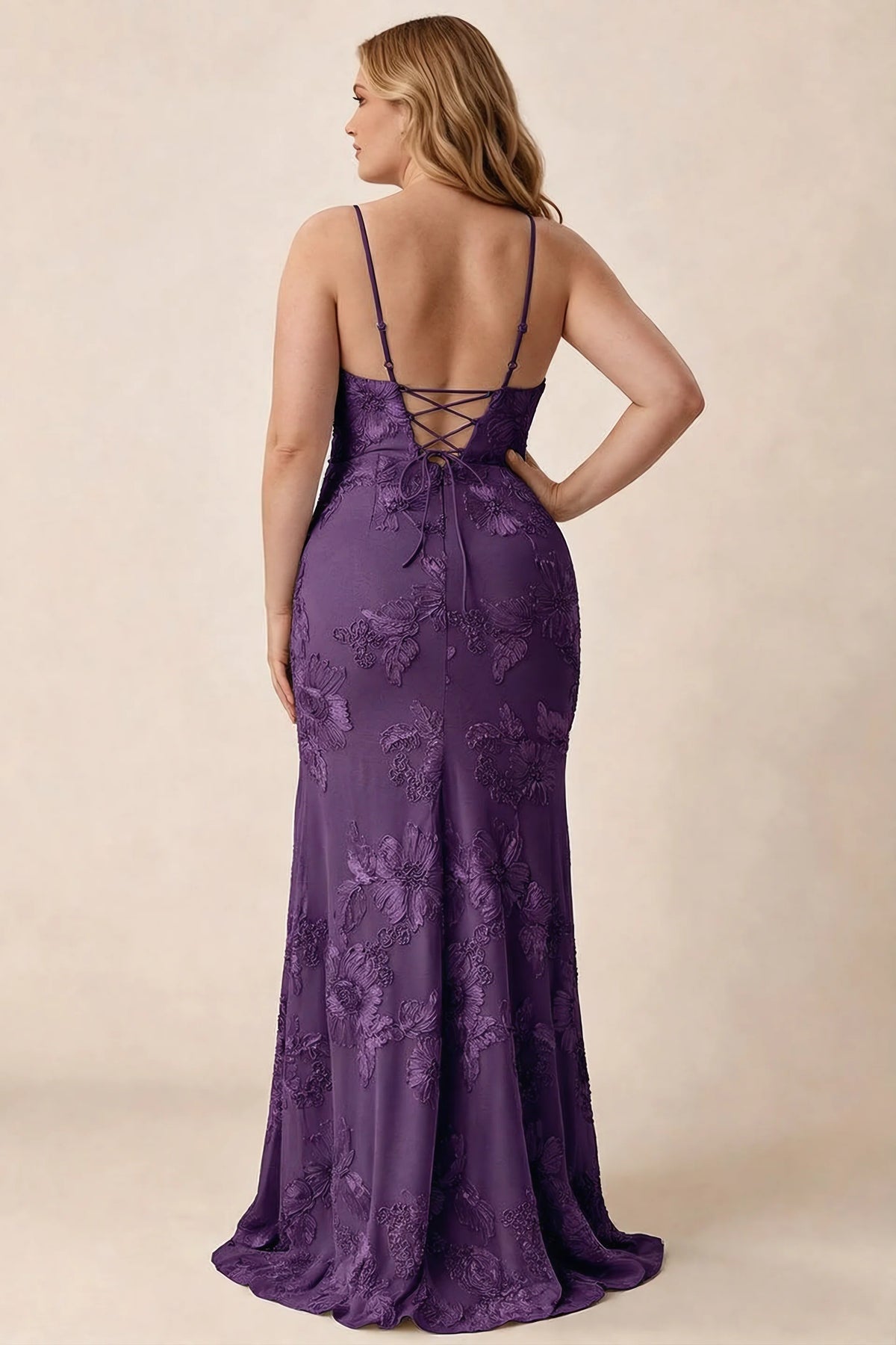 Rear studio view of Brianna plum floral dress showing the fitted hips and long hem