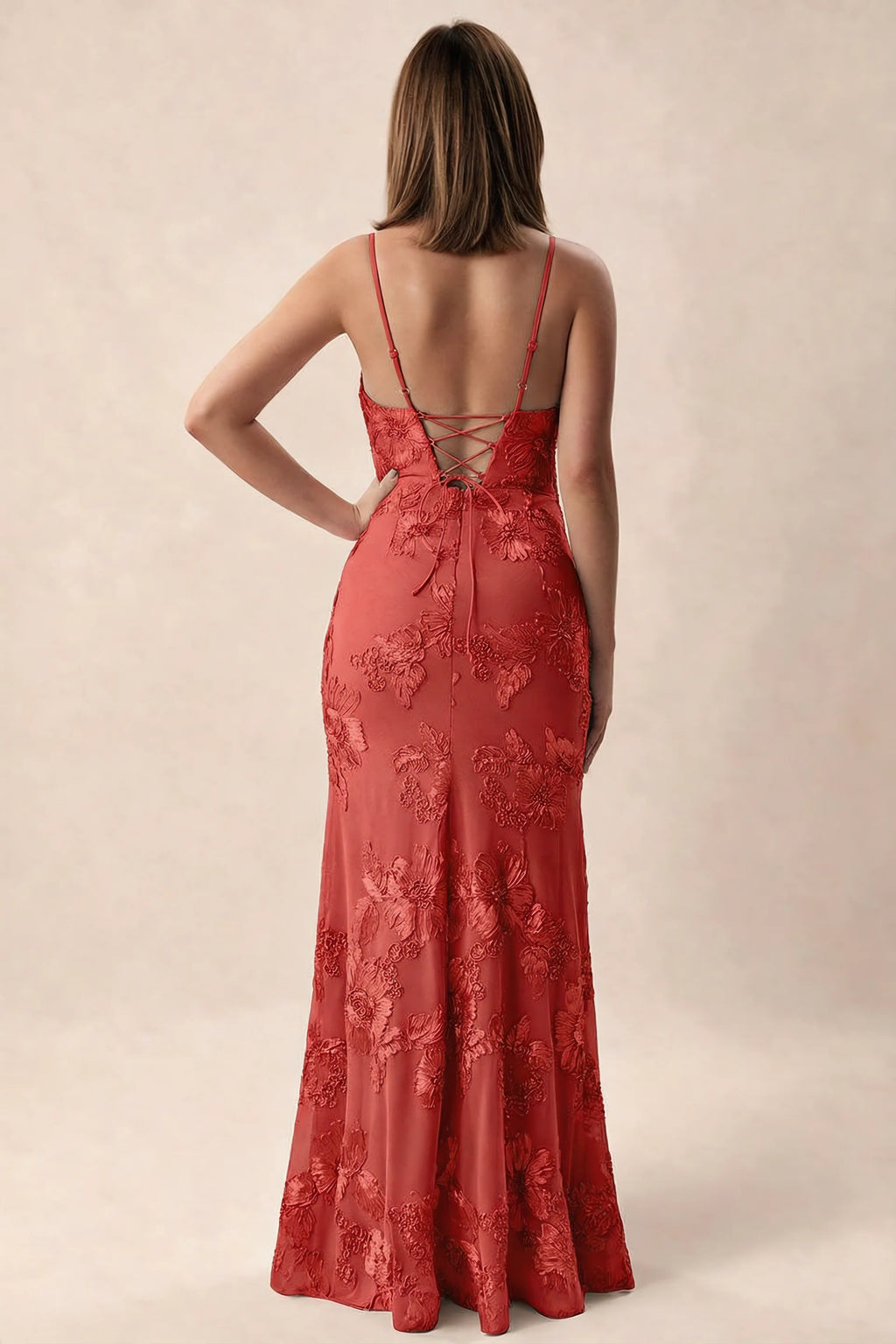 Rear studio view of Brianna red dress showing adjustable shoulder straps and crossed back lacing