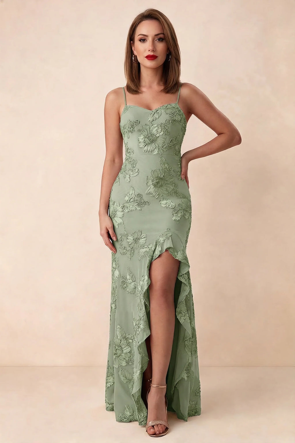 Front studio view of Brianna sage green floral maxi dress with thin straps and a high ruffle-edged opening
