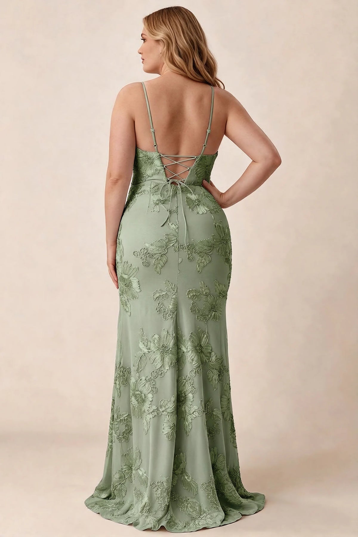 Rear studio view of Brianna sage green floral dress showing the fitted hips and long hem