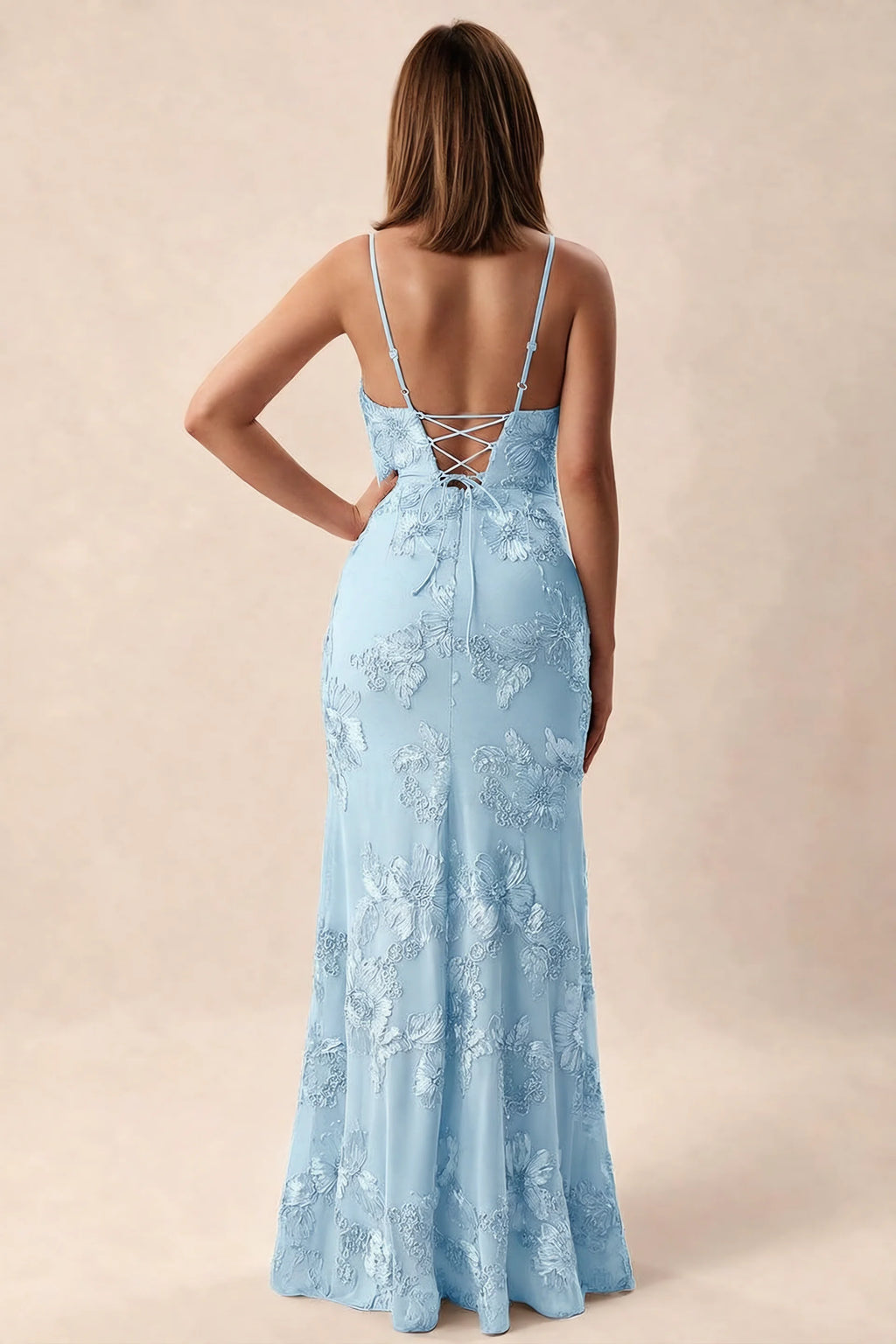 Rear studio view of Brianna sky blue dress showing adjustable shoulder straps and crossed back lacing