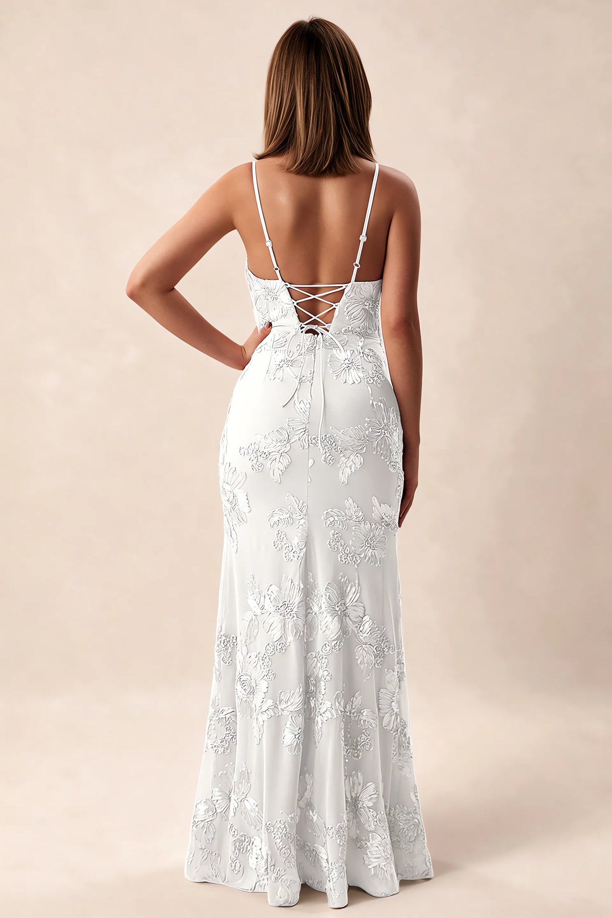 Rear studio view of Brianna white dress showing adjustable shoulder straps and crossed back lacing