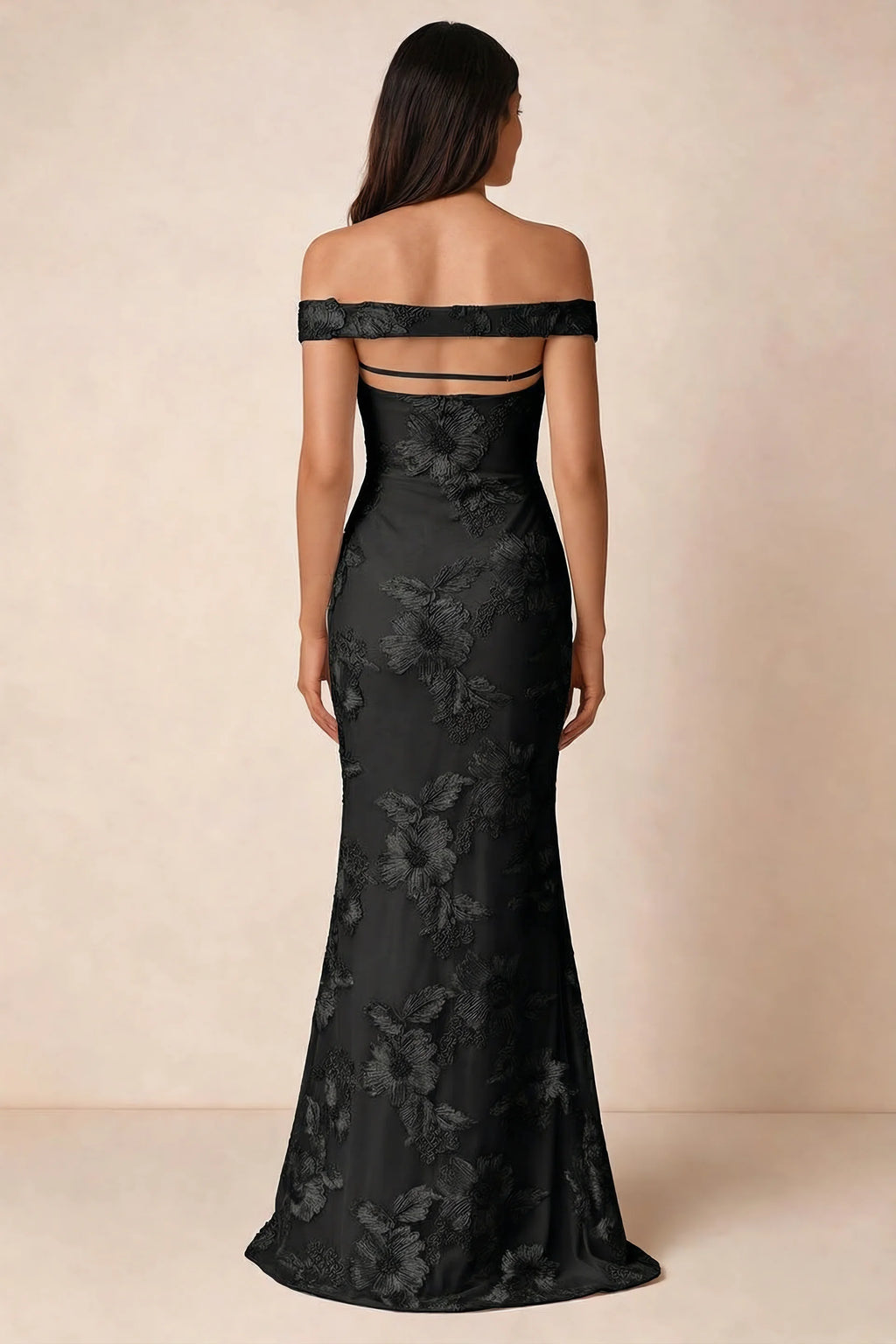 Rear studio view of Bridgette black dress showing the horizontal straps across the open upper back