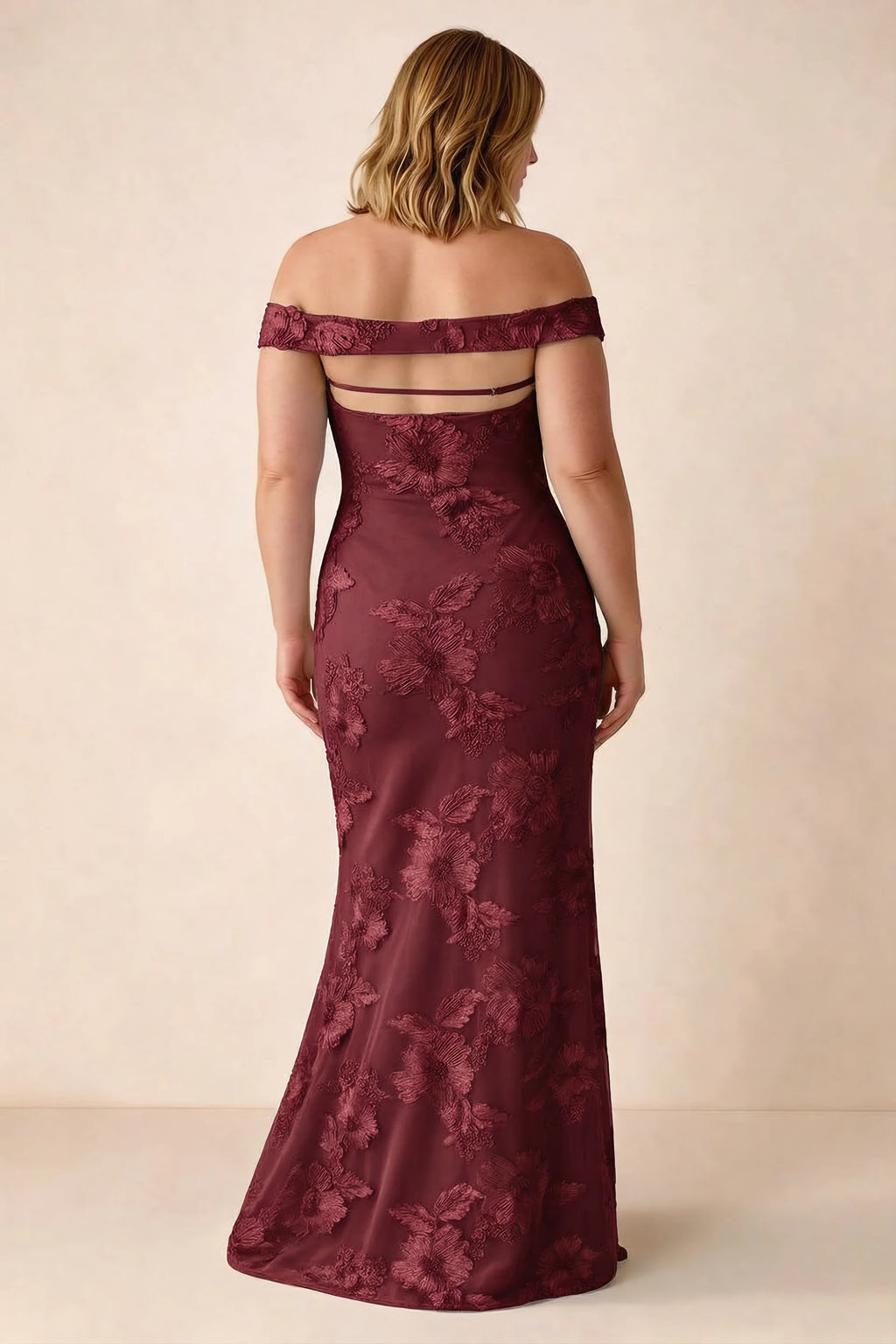 Rear studio view of Bridgette burgundy dress on a second model, showing the flared skirt
