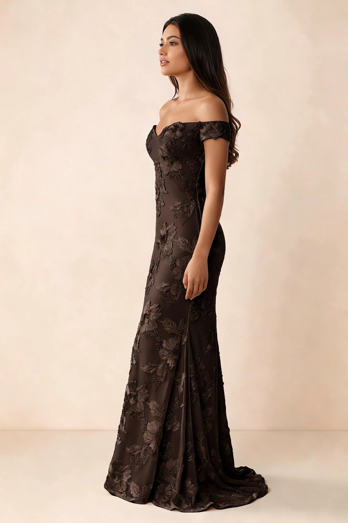 Side studio view of Bridgette chocolate brown dress showing the fitted hips and trailing back hem