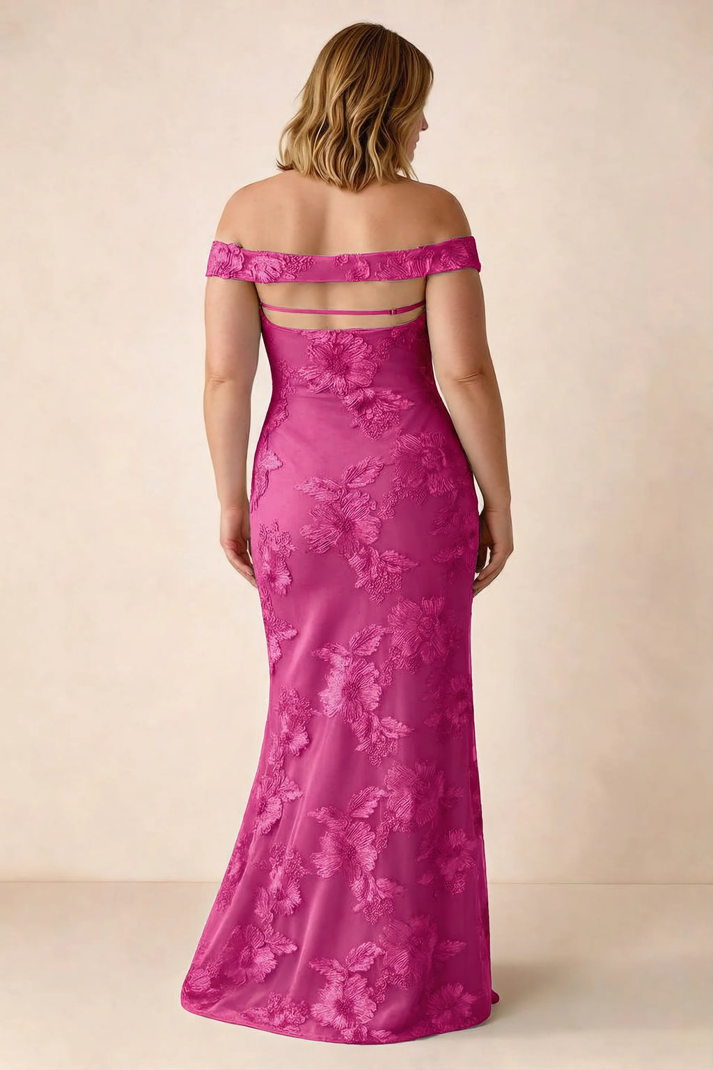 Rear studio view of Bridgette fuchsia dress on a second model, showing the flared skirt