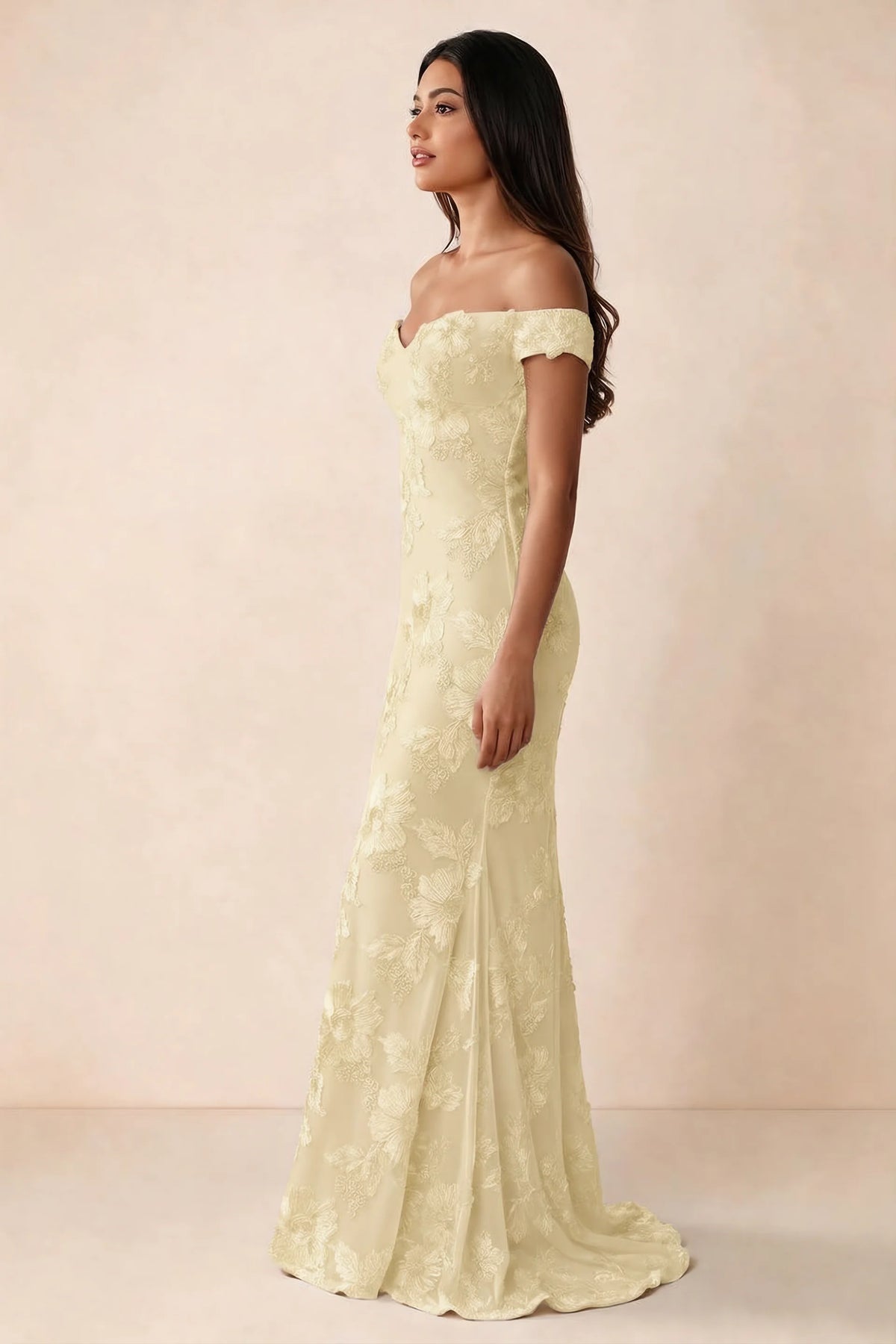 Side studio view of Bridgette lemon dress showing the fitted hips and trailing back hem