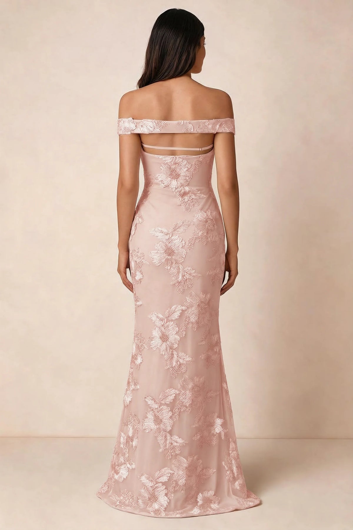Rear studio view of Bridgette light pink dress showing the horizontal straps across the open upper back