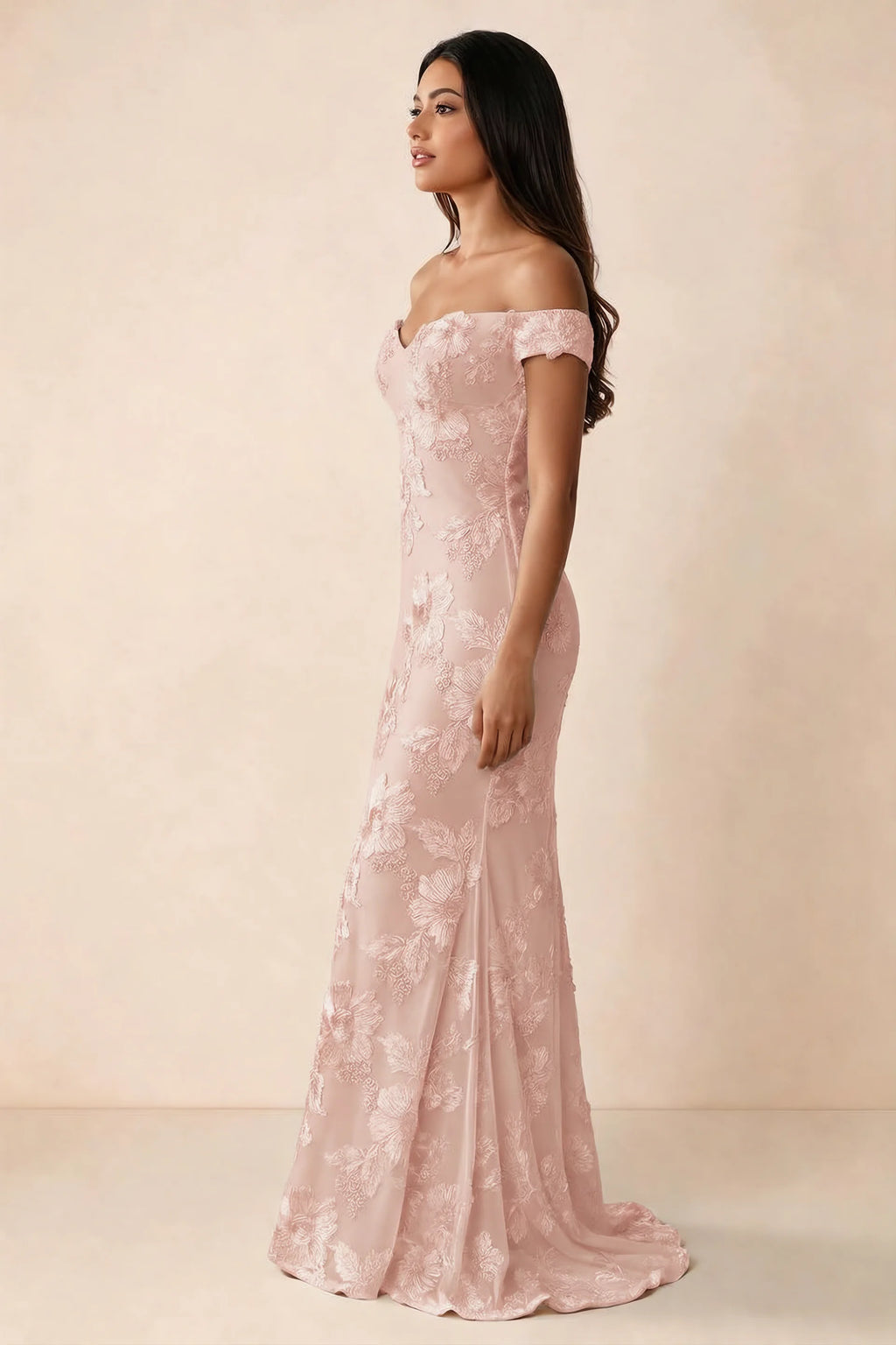 Side studio view of Bridgette light pink dress showing the fitted hips and trailing back hem
