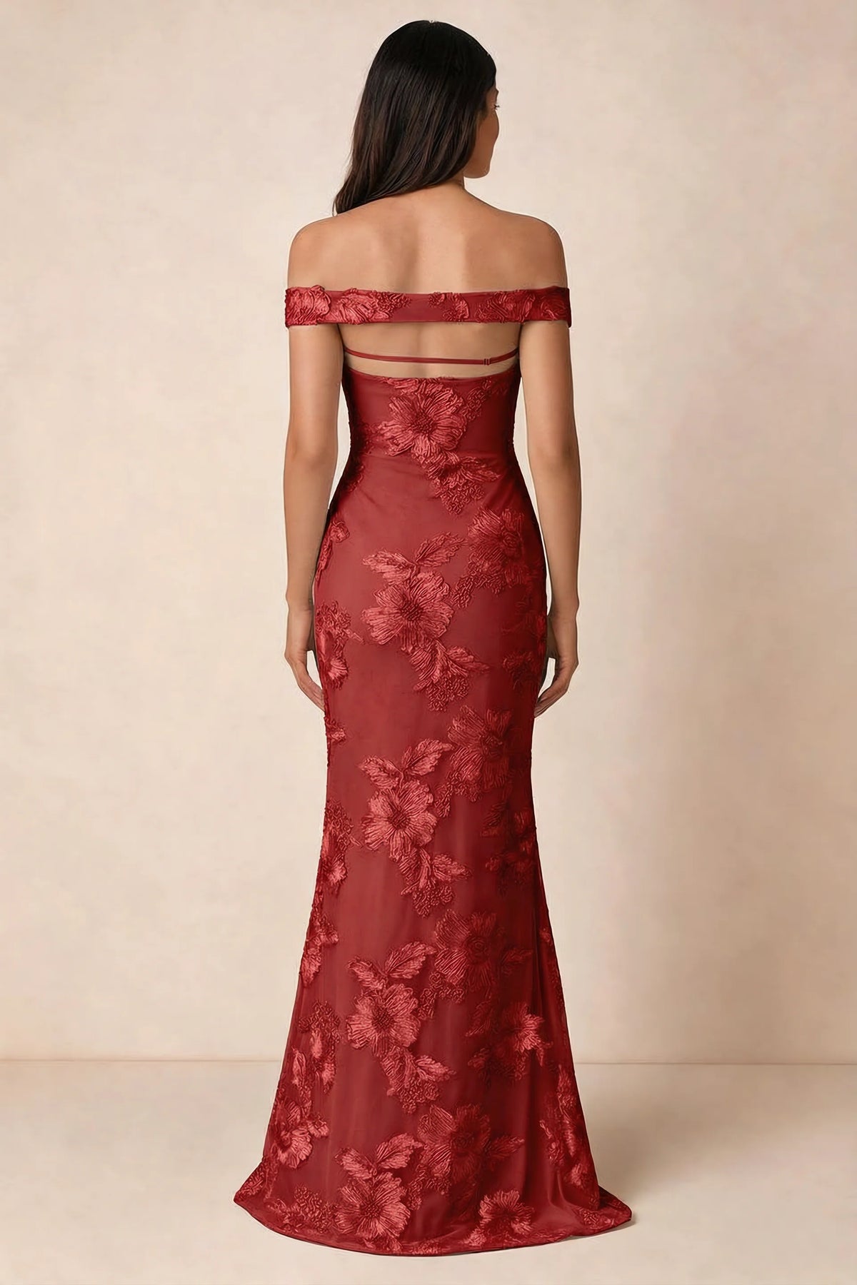 Rear studio view of Bridgette red dress showing the horizontal straps across the open upper back