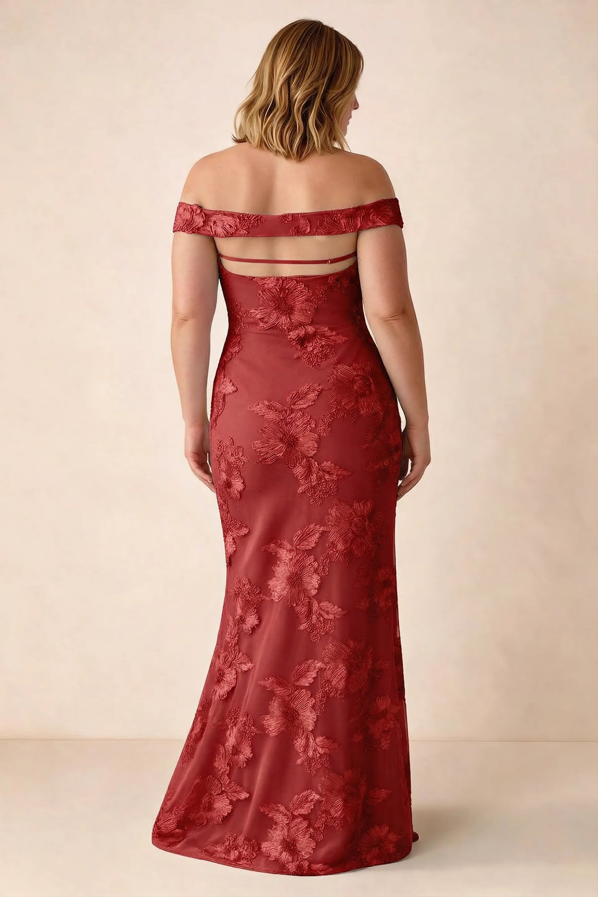 Rear studio view of Bridgette red dress on a second model, showing the flared skirt