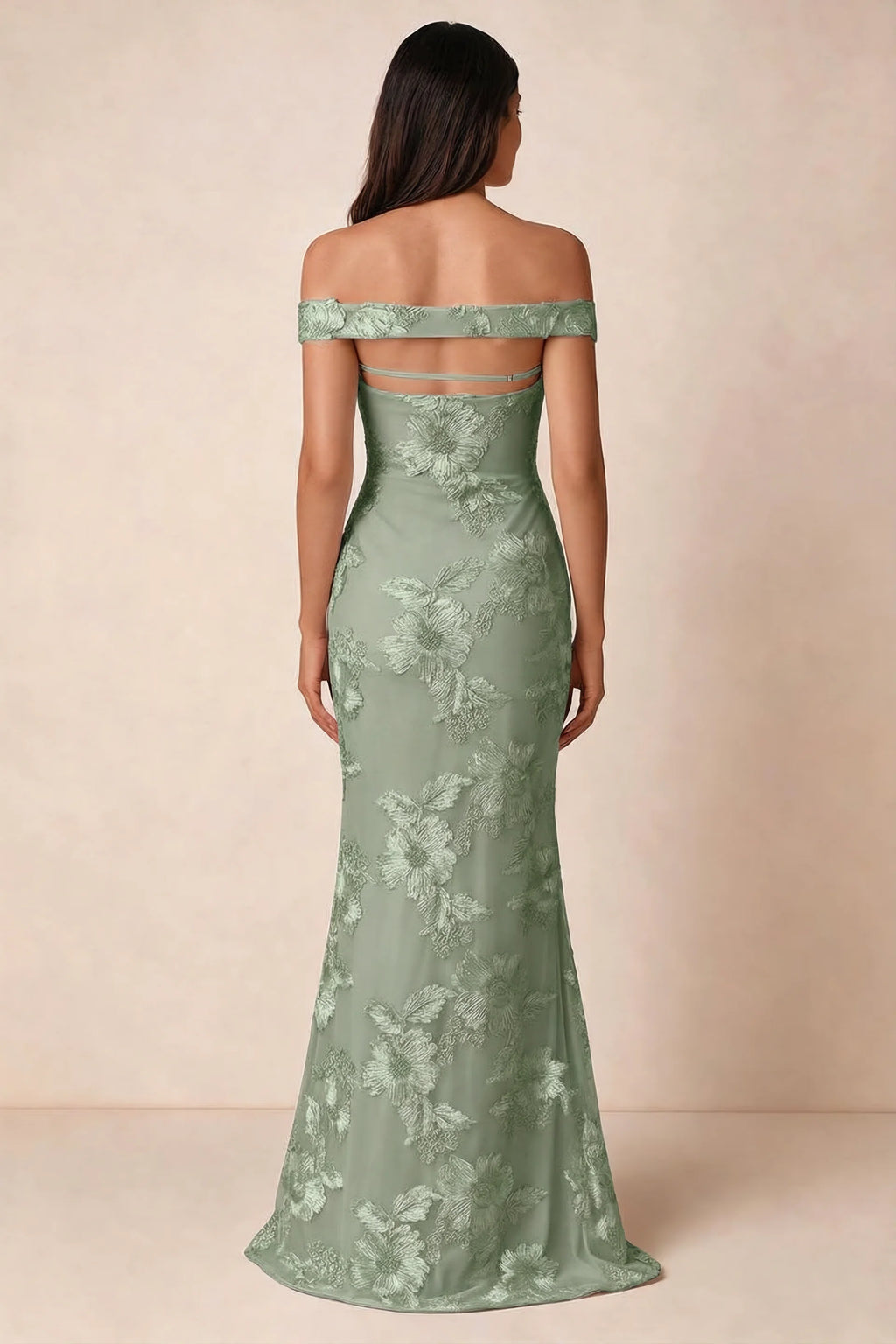 Rear studio view of Bridgette sage green dress showing the horizontal straps across the open upper back