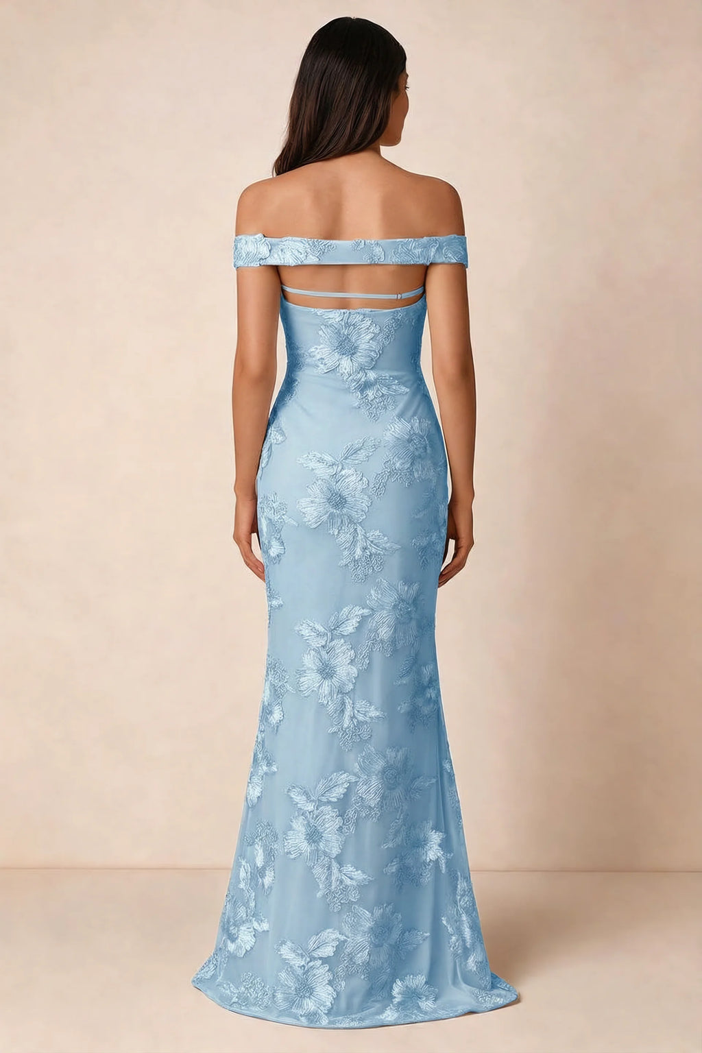 Rear studio view of Bridgette sky blue dress showing the horizontal straps across the open upper back