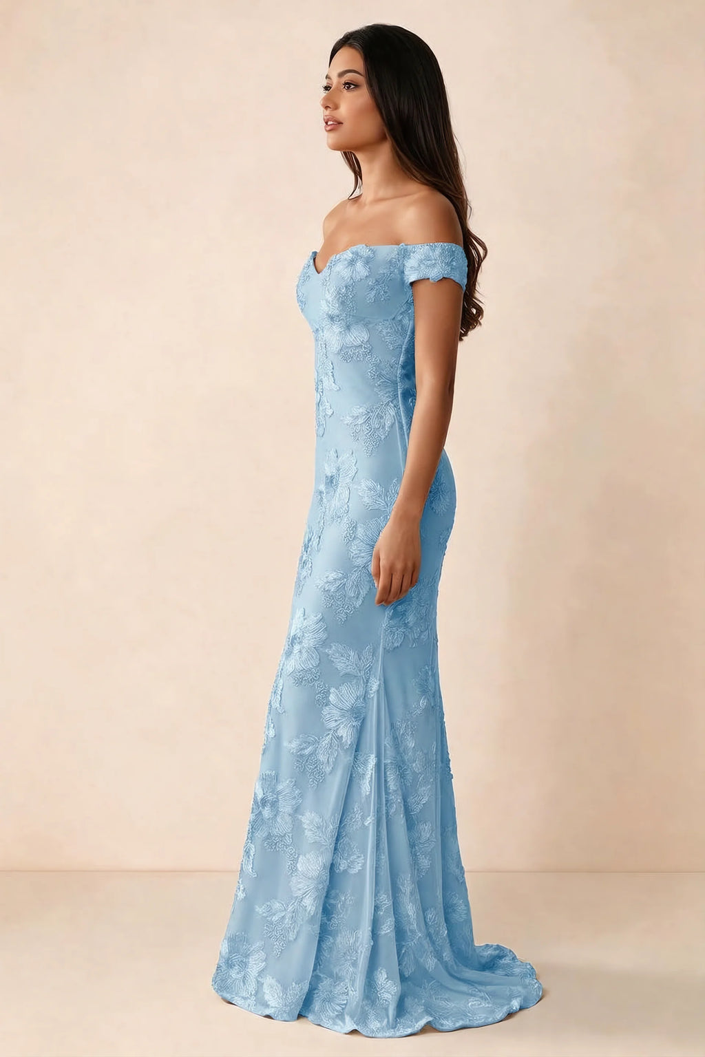 Side studio view of Bridgette sky blue dress showing the fitted hips and trailing back hem