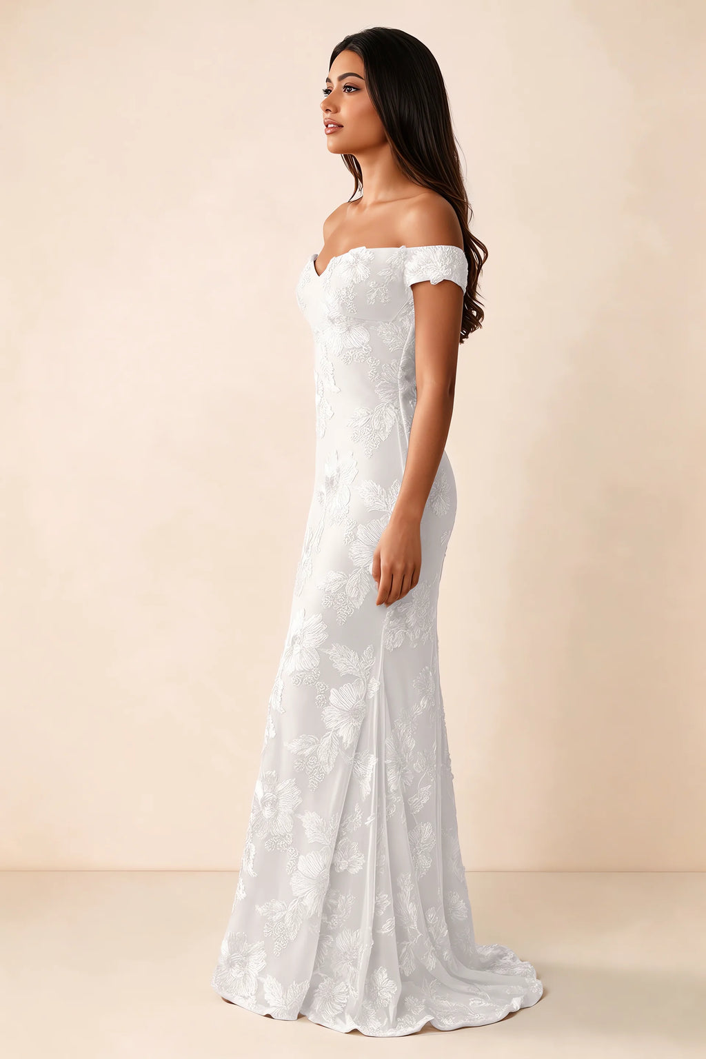 Side studio view of Bridgette white dress showing the fitted hips and trailing back hem