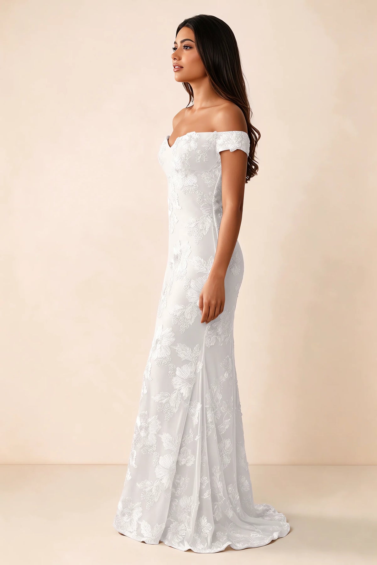 Side studio view of Bridgette white dress showing the fitted hips and trailing back hem