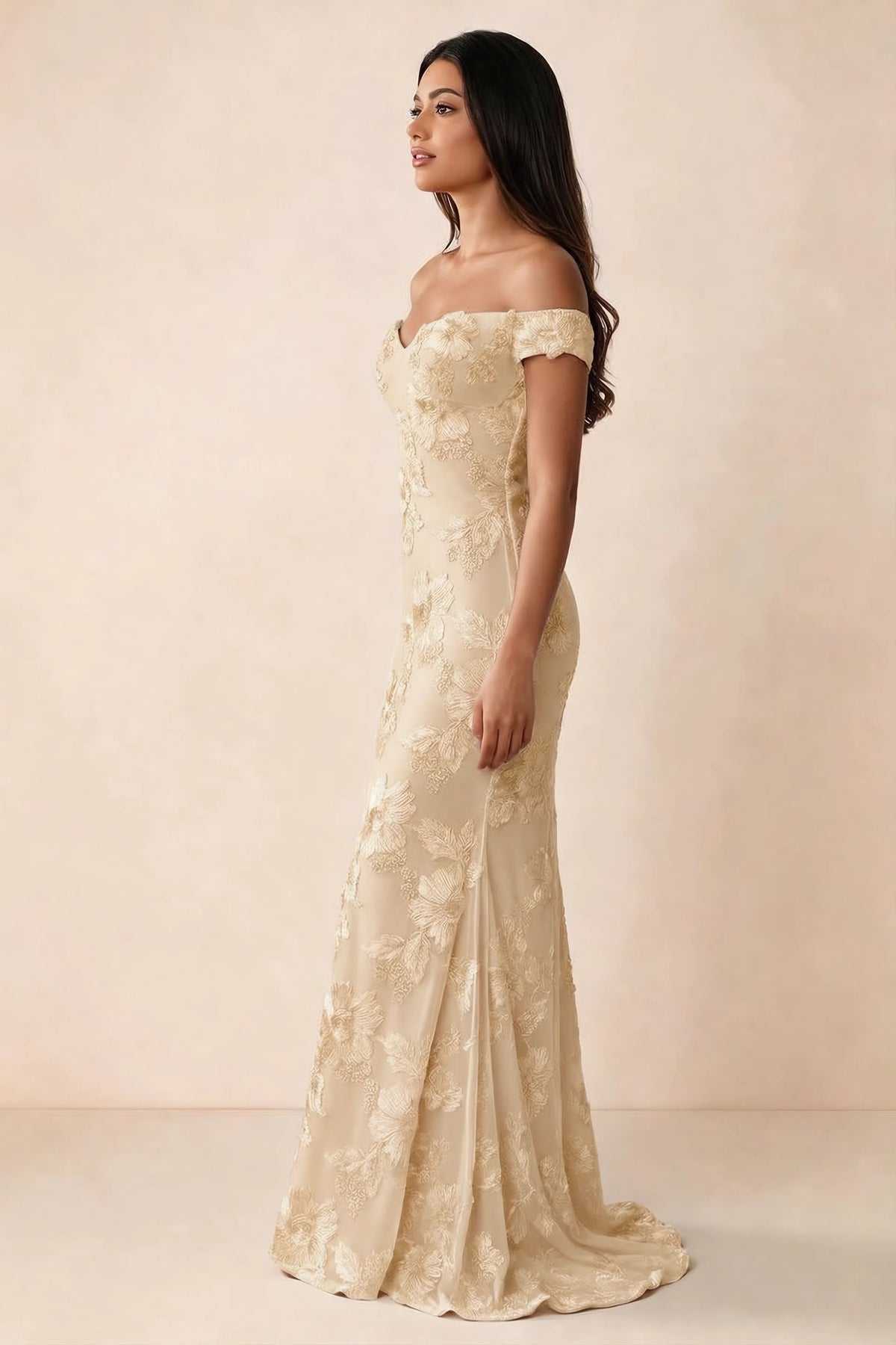 Side studio view of Bridgette yellow dress showing the fitted hips and trailing back hem