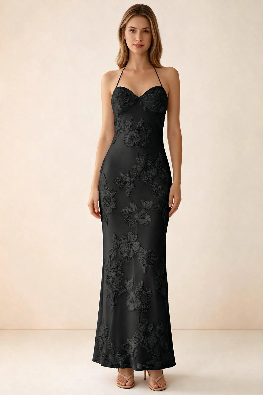 Front studio view of Brigitte black floral maxi dress with sweetheart neckline and fine halter ties