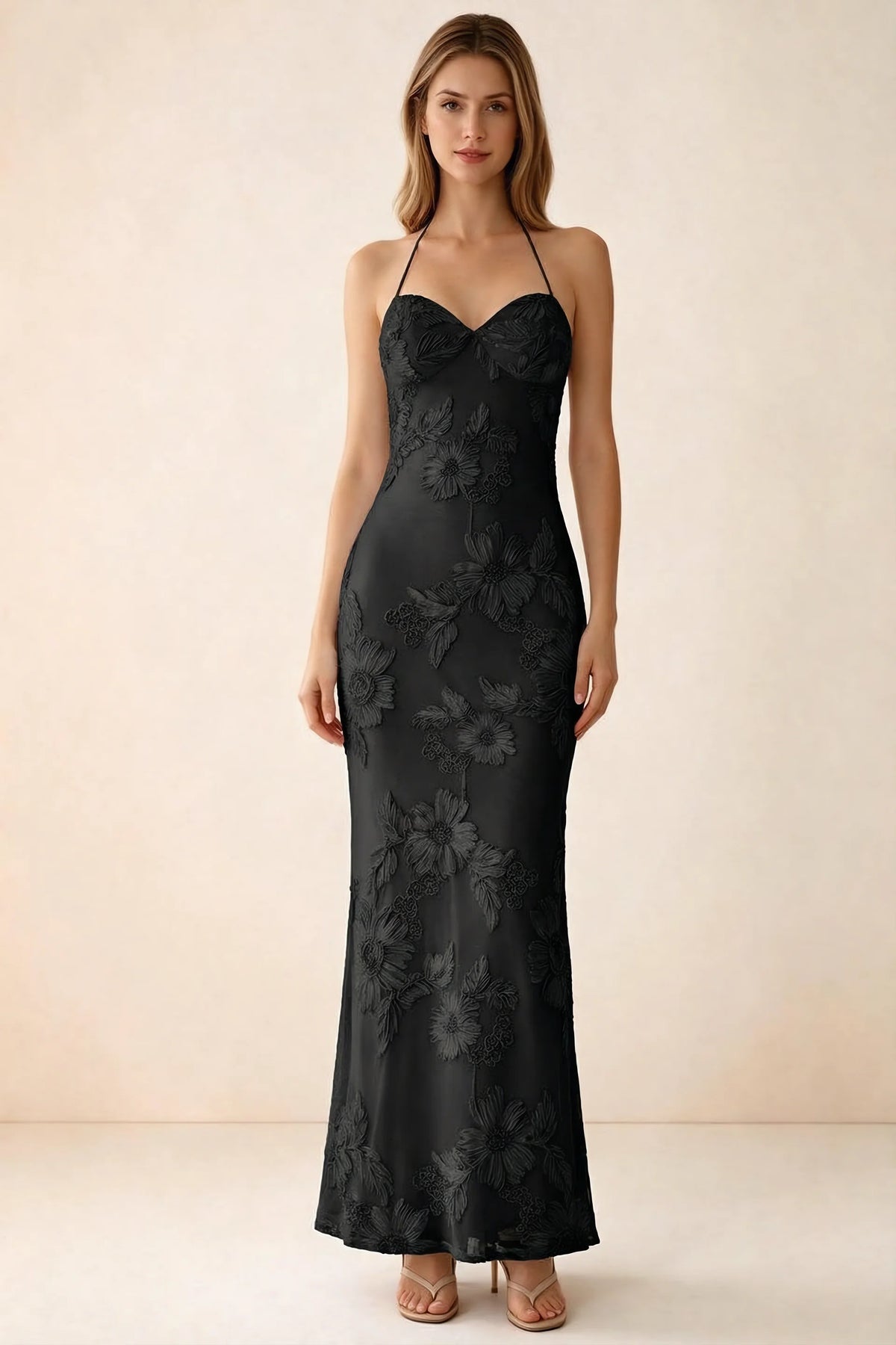 Front studio view of Brigitte black floral maxi dress with sweetheart neckline and fine halter ties