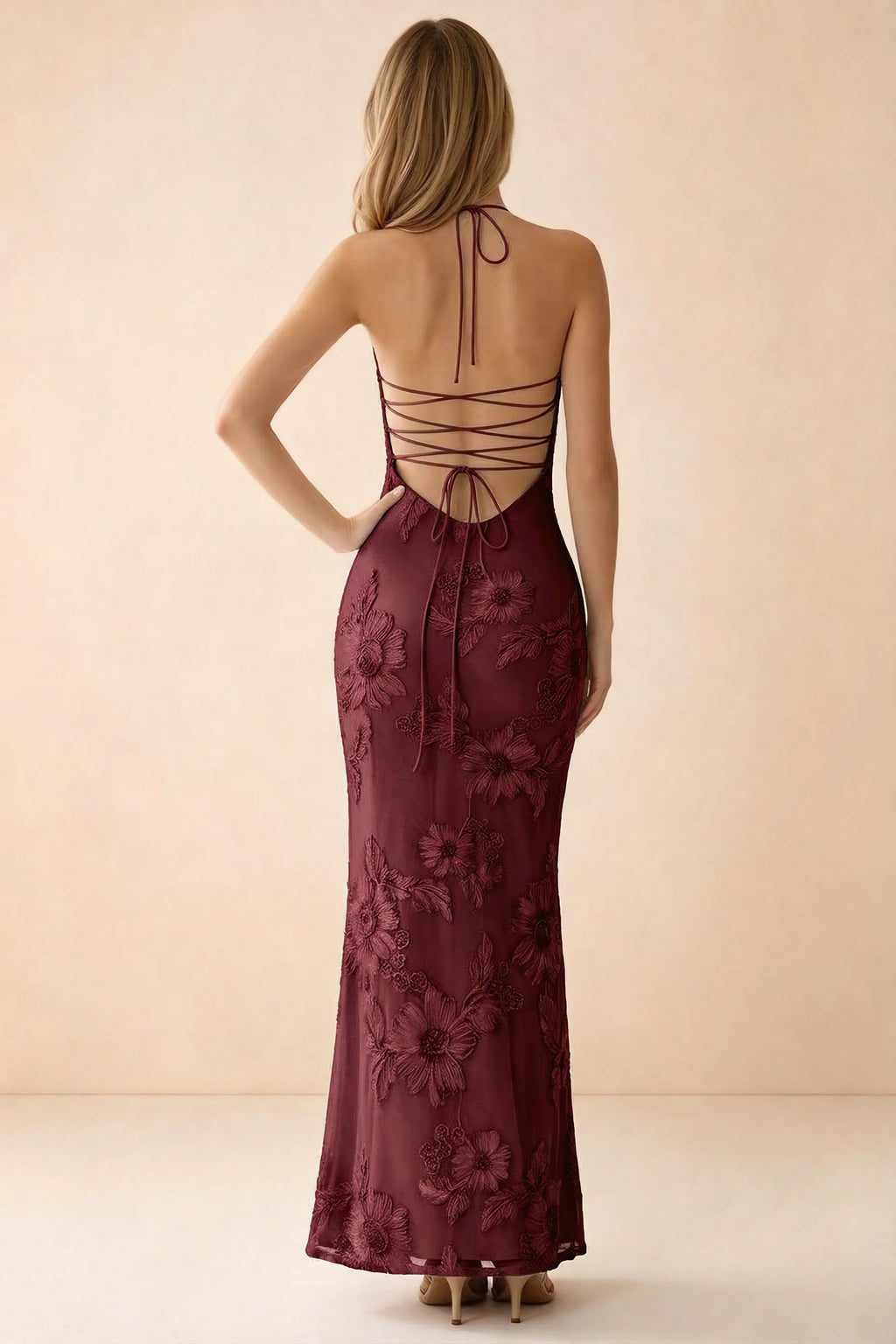 Rear studio view of Brigitte burgundy dress showing crossed lacing across the low open back