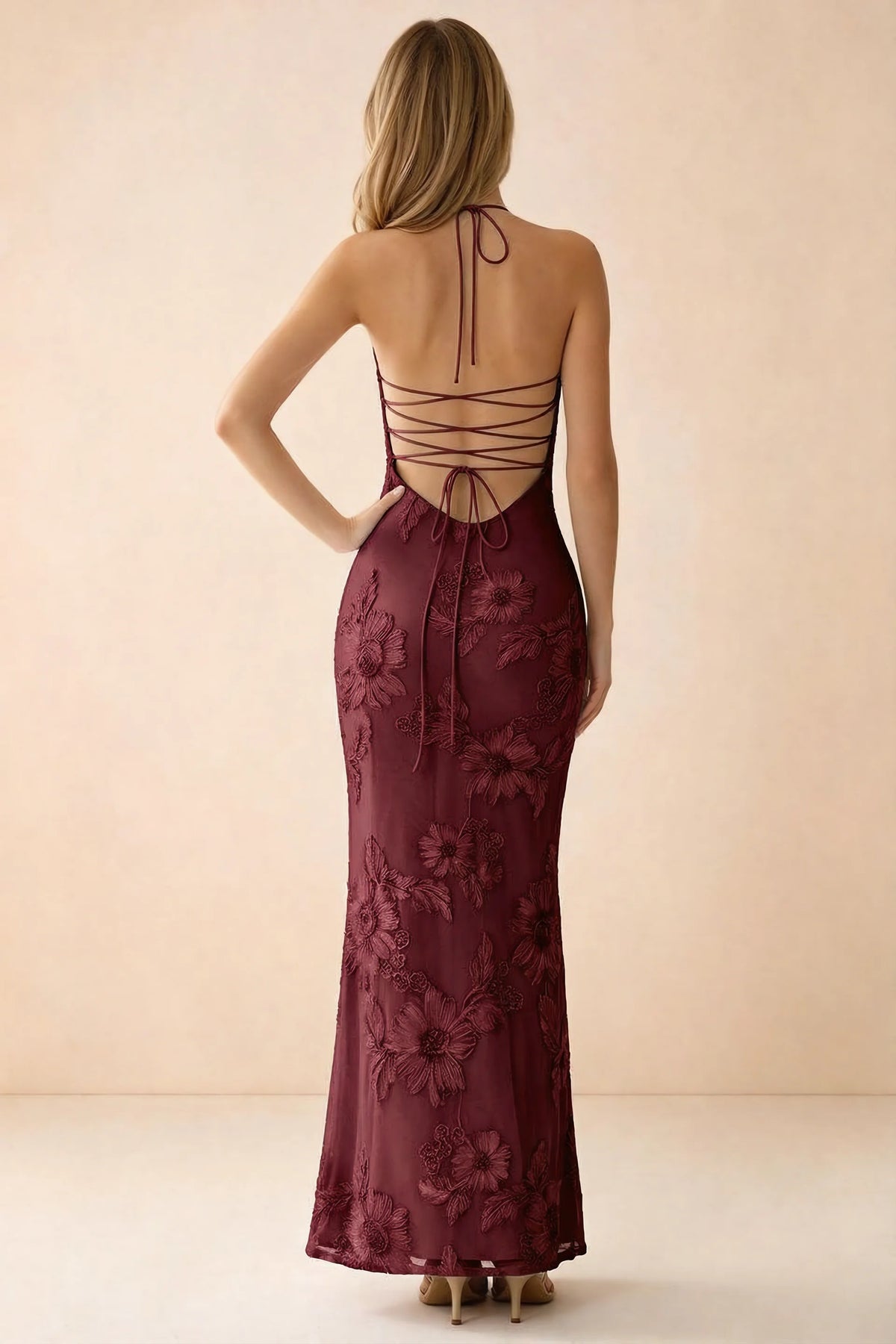 Rear studio view of Brigitte burgundy dress showing crossed lacing across the low open back