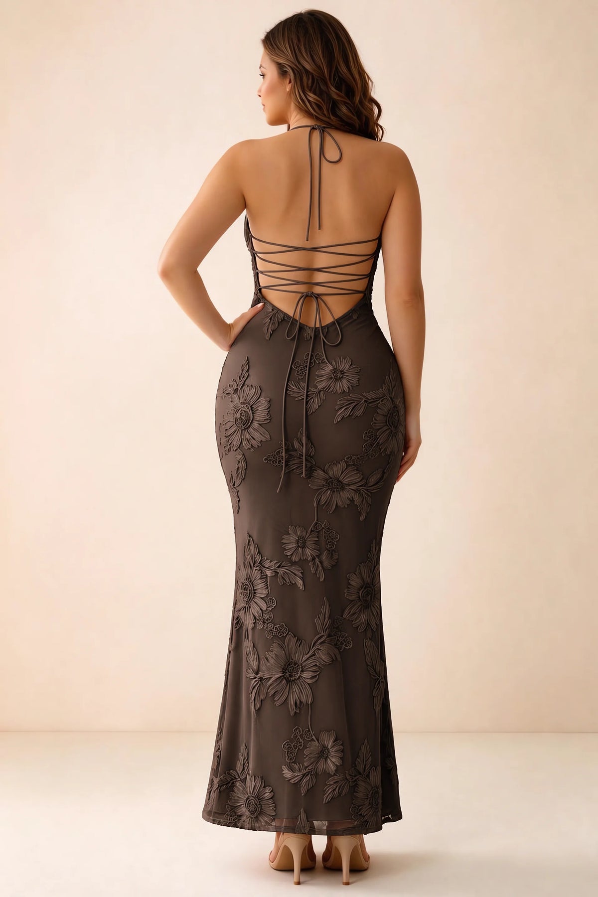Rear studio view of Brigitte chocolate brown dress on a second model, showing the back lacing and long skirt