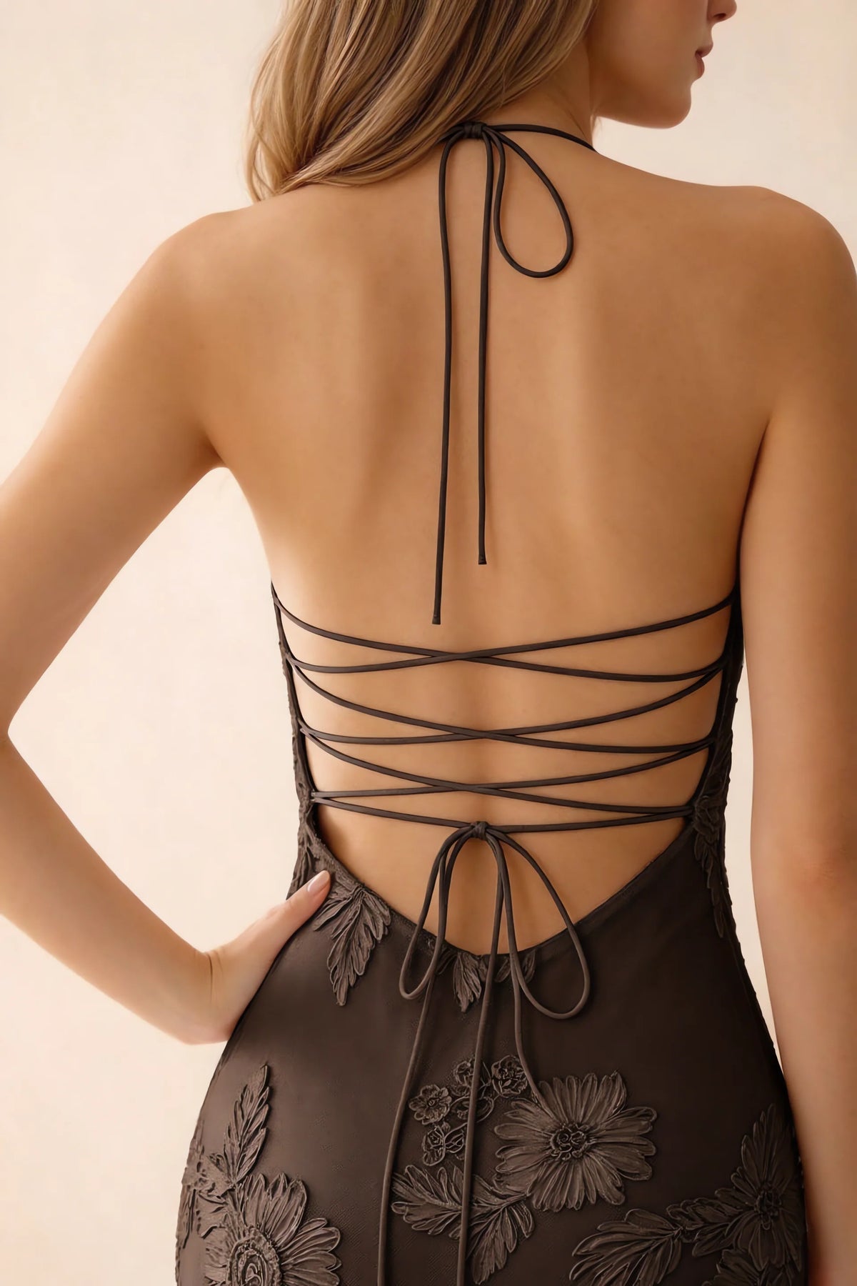 Close-up of Brigitte chocolate brown neck tie and crossed lacing across the open back